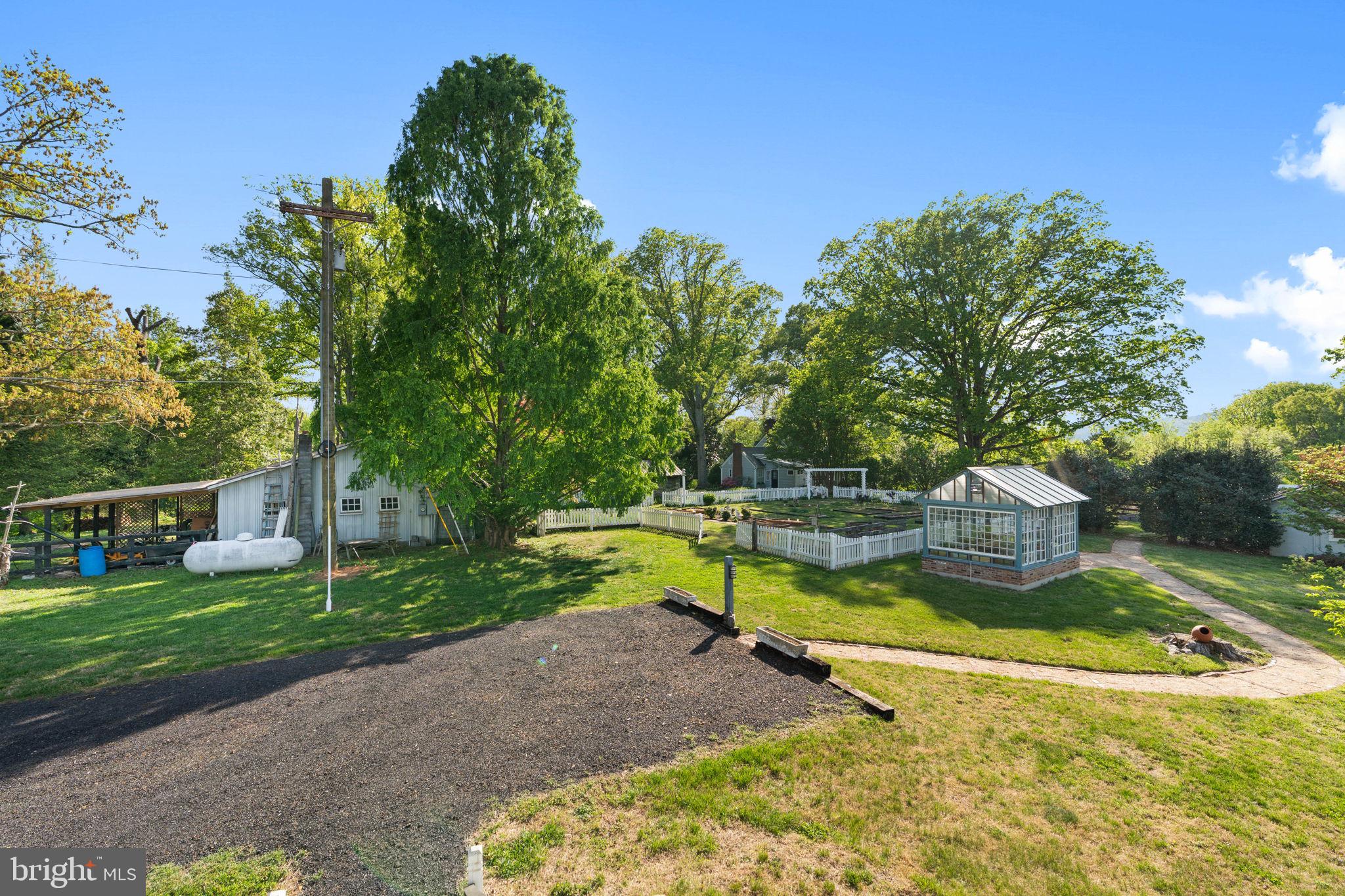 324 North Blue Ridge Turnpike Madison, VA 22727 - Photo 59 of 75 a view of a house with swimming pool and yard