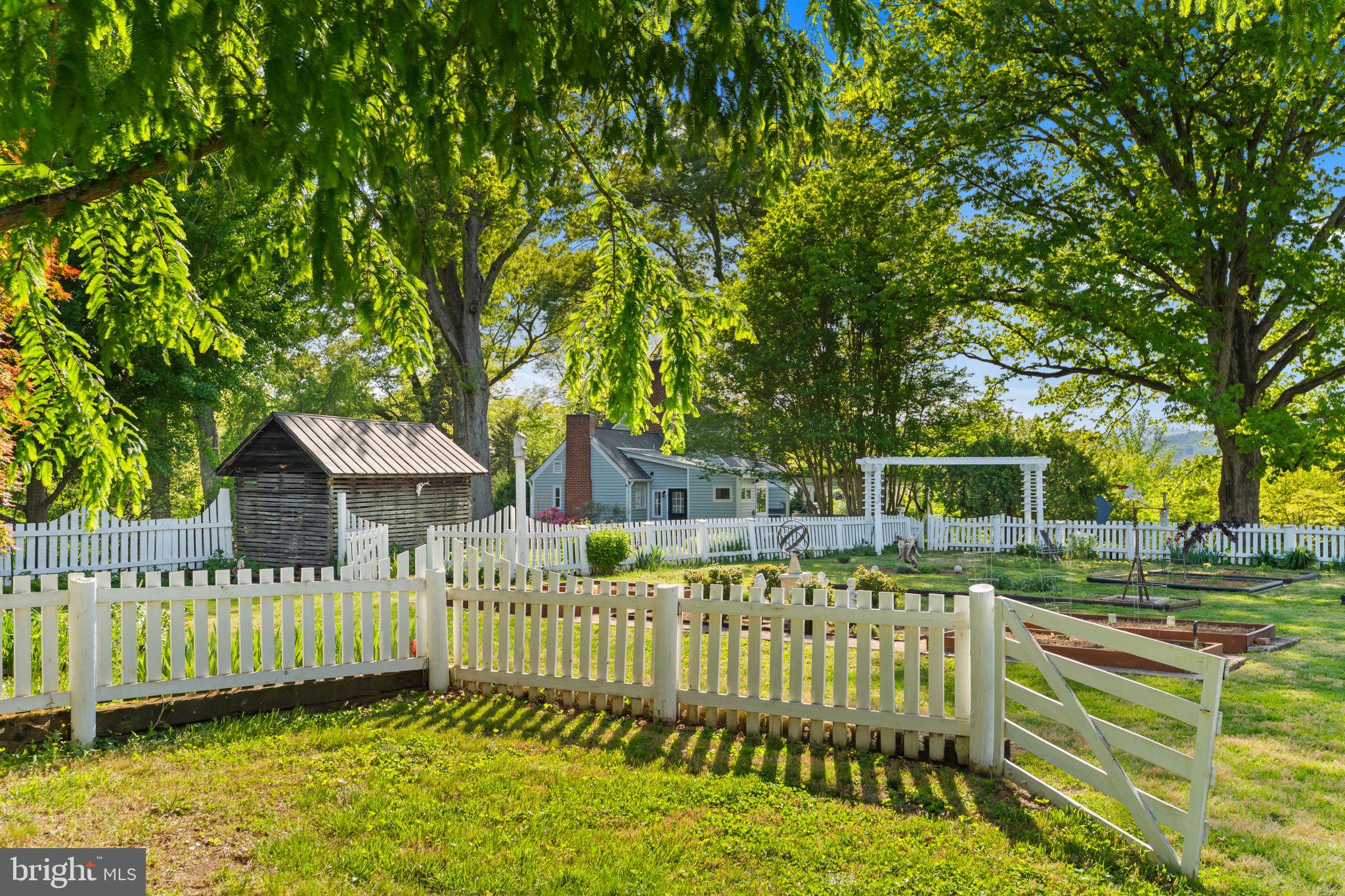 324 North Blue Ridge Turnpike Madison, VA 22727 - Photo 60 of 75 a front view of a house with a yard table and chairs