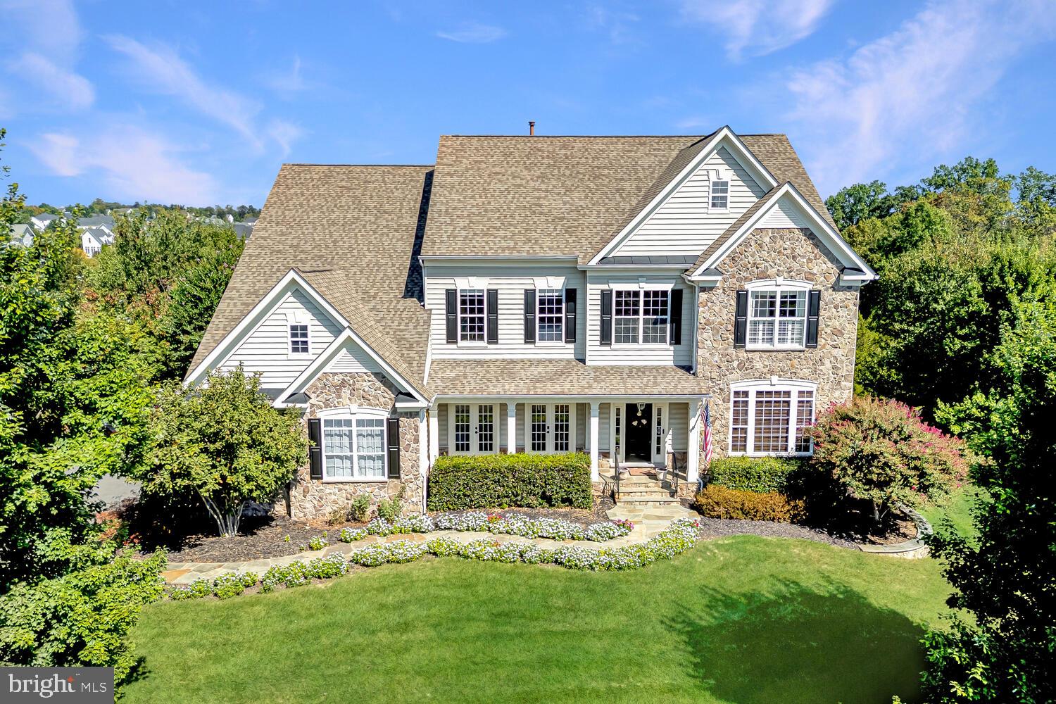 43024 La Riva Drive Ashburn, VA 20148 - Photo 1 of 63 a front view of a house with a yard