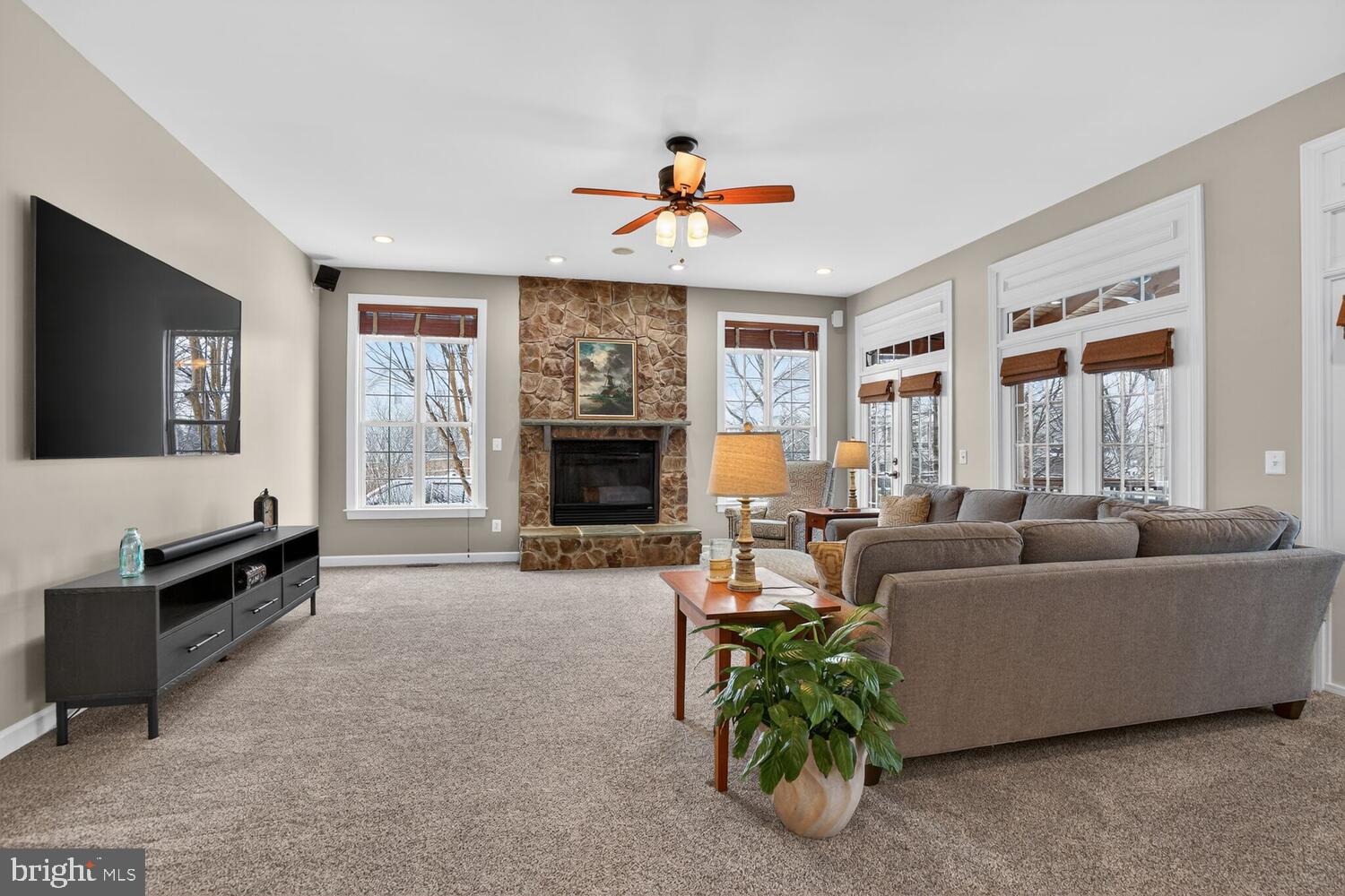 43024 La Riva Drive Ashburn, VA 20148 - Photo 18 of 63 a living room with furniture and a fireplace