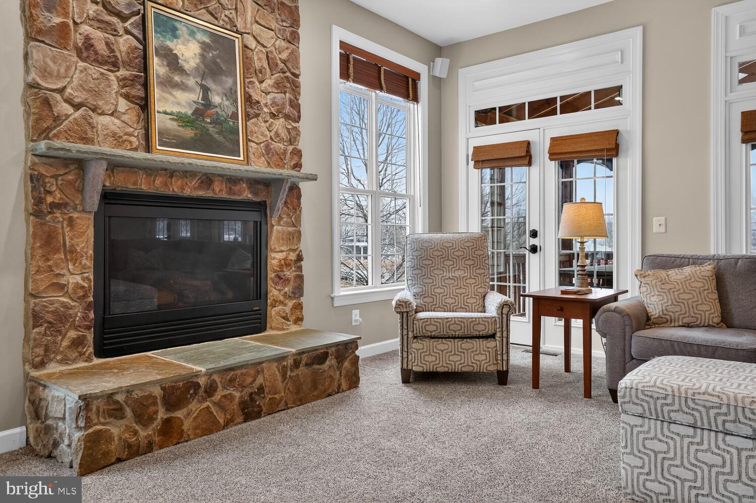 43024 La Riva Drive Ashburn, VA 20148 - Photo 19 of 63 a living room with furniture and a fireplace