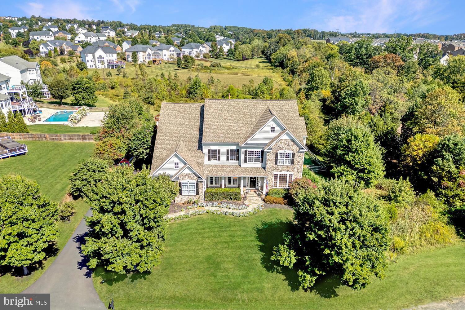 43024 La Riva Drive Ashburn, VA 20148 - Photo 2 of 63 an aerial view of a house with a garden