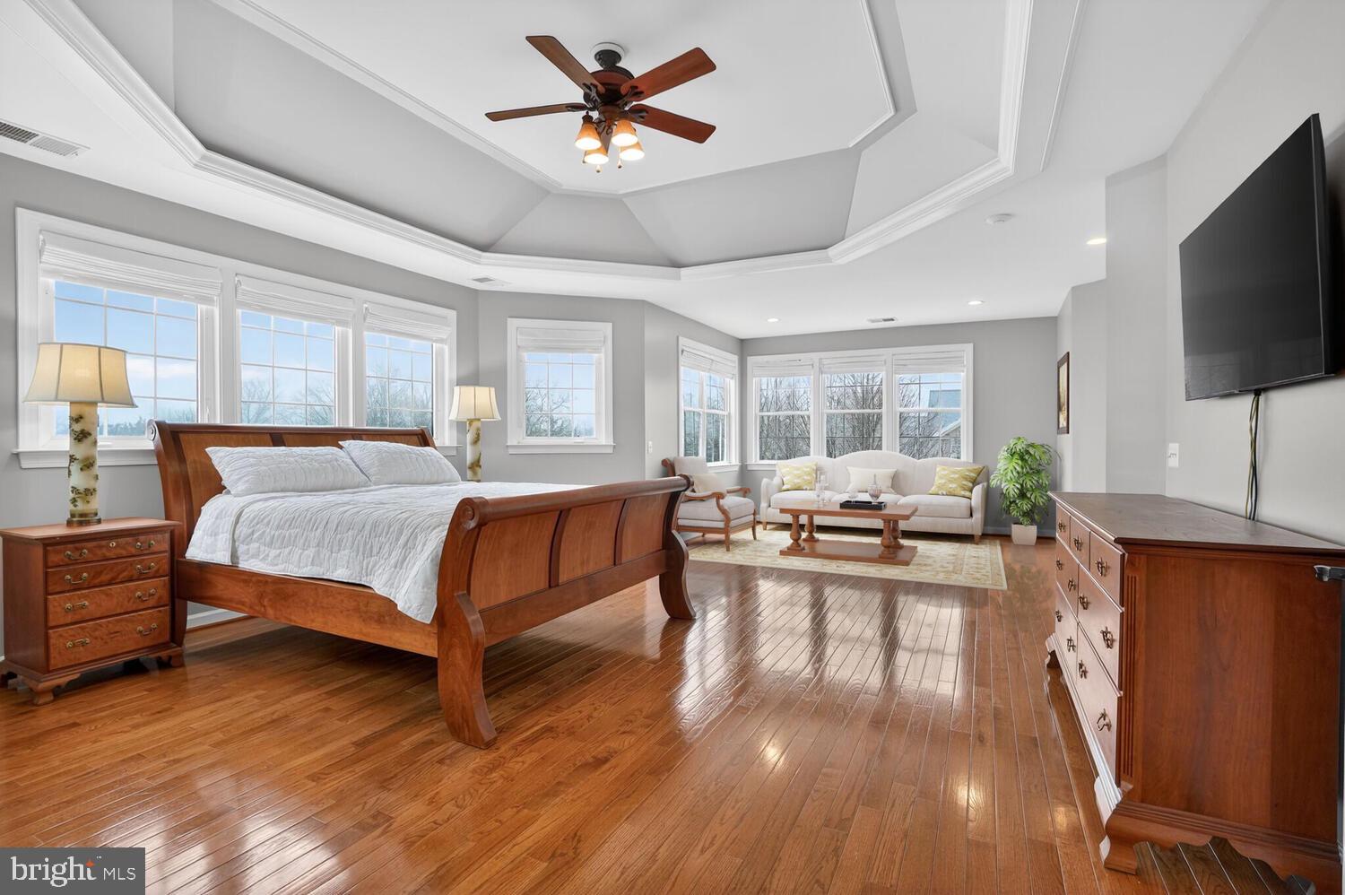 43024 La Riva Drive Ashburn, VA 20148 - Photo 30 of 63 a bed room with furniture and a flat screen tv