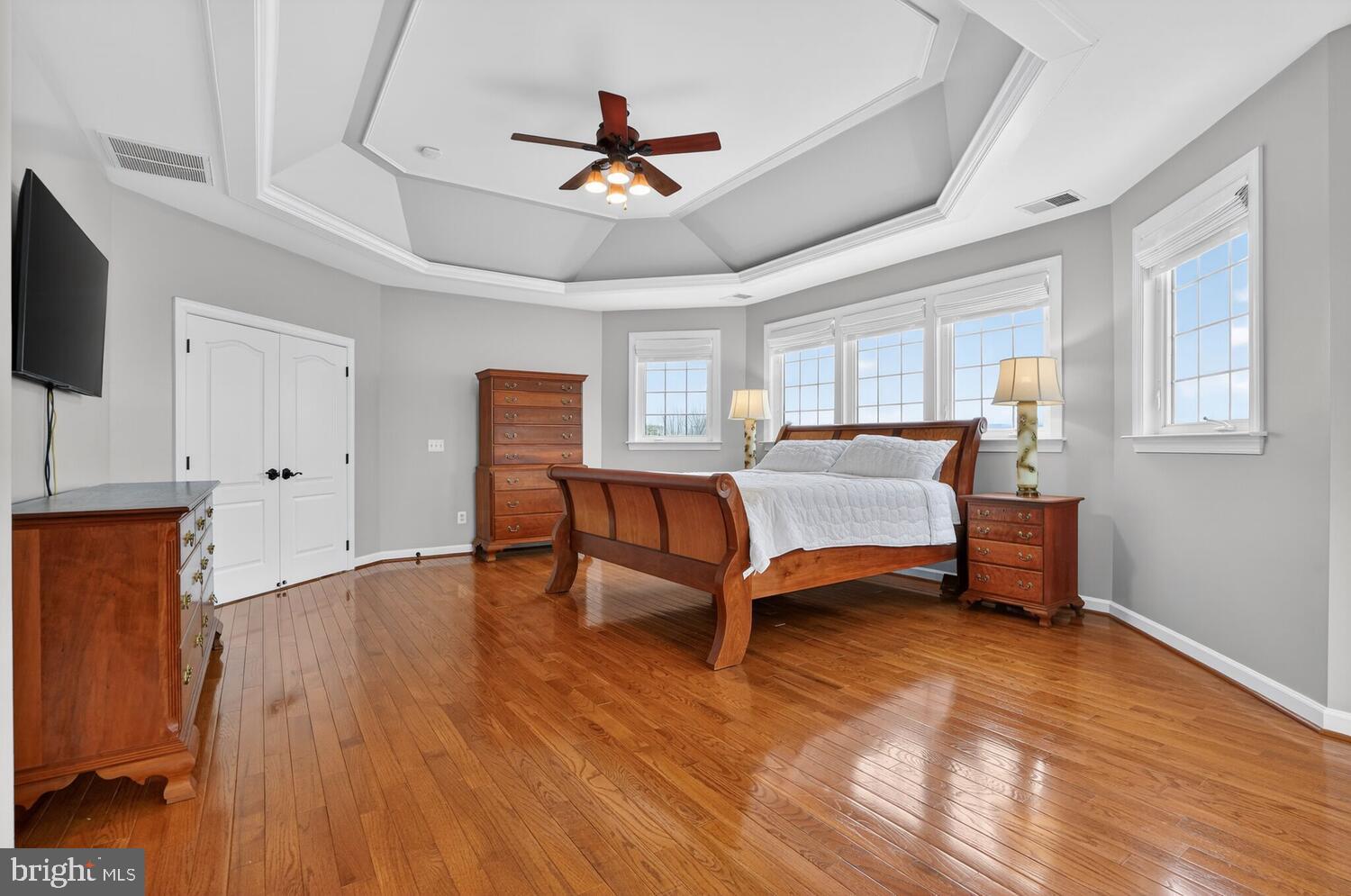 43024 La Riva Drive Ashburn, VA 20148 - Photo 32 of 63 a bedroom with a bed and a chandelier
