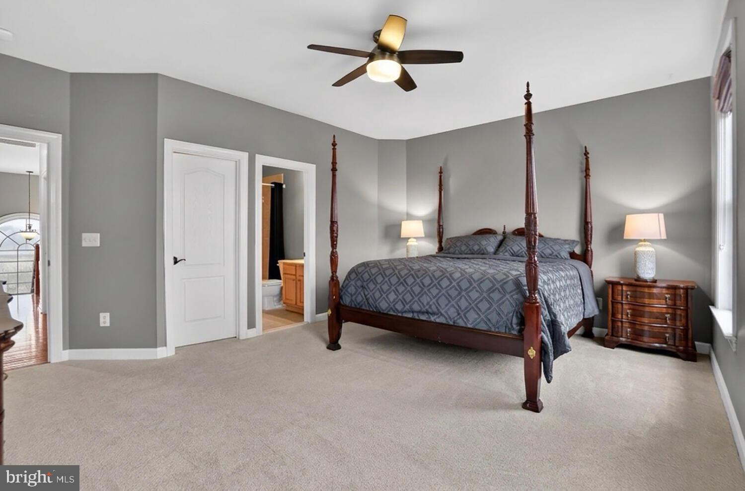 43024 La Riva Drive Ashburn, VA 20148 - Photo 43 of 63 a bedroom with a bed and a chandelier