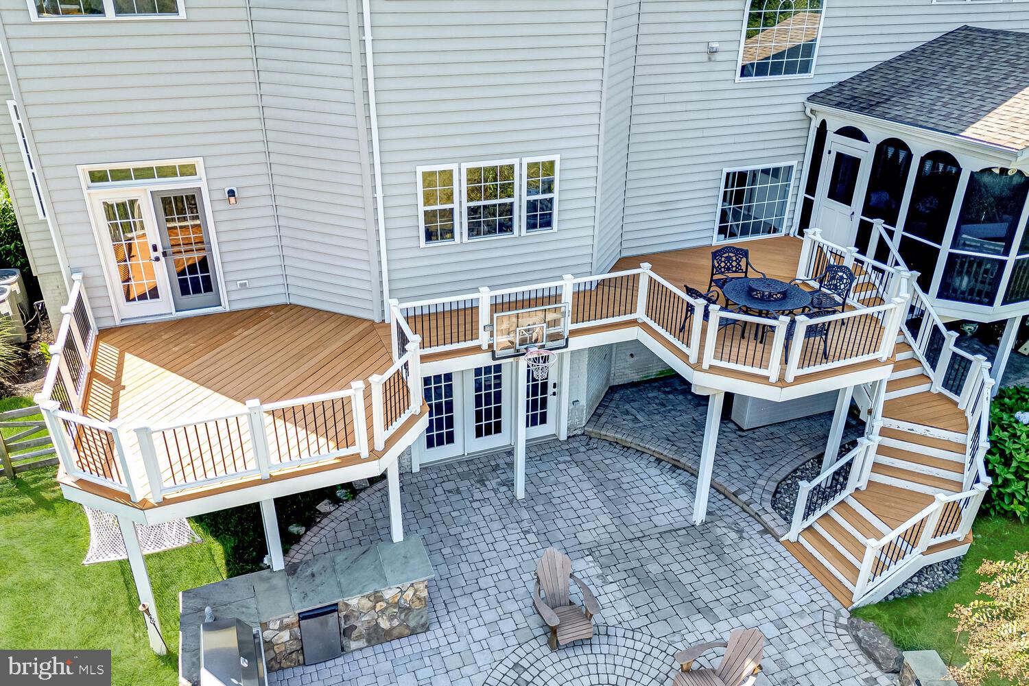 43024 La Riva Drive Ashburn, VA 20148 - Photo 56 of 63 a front view of a house with a yard and wooden fence