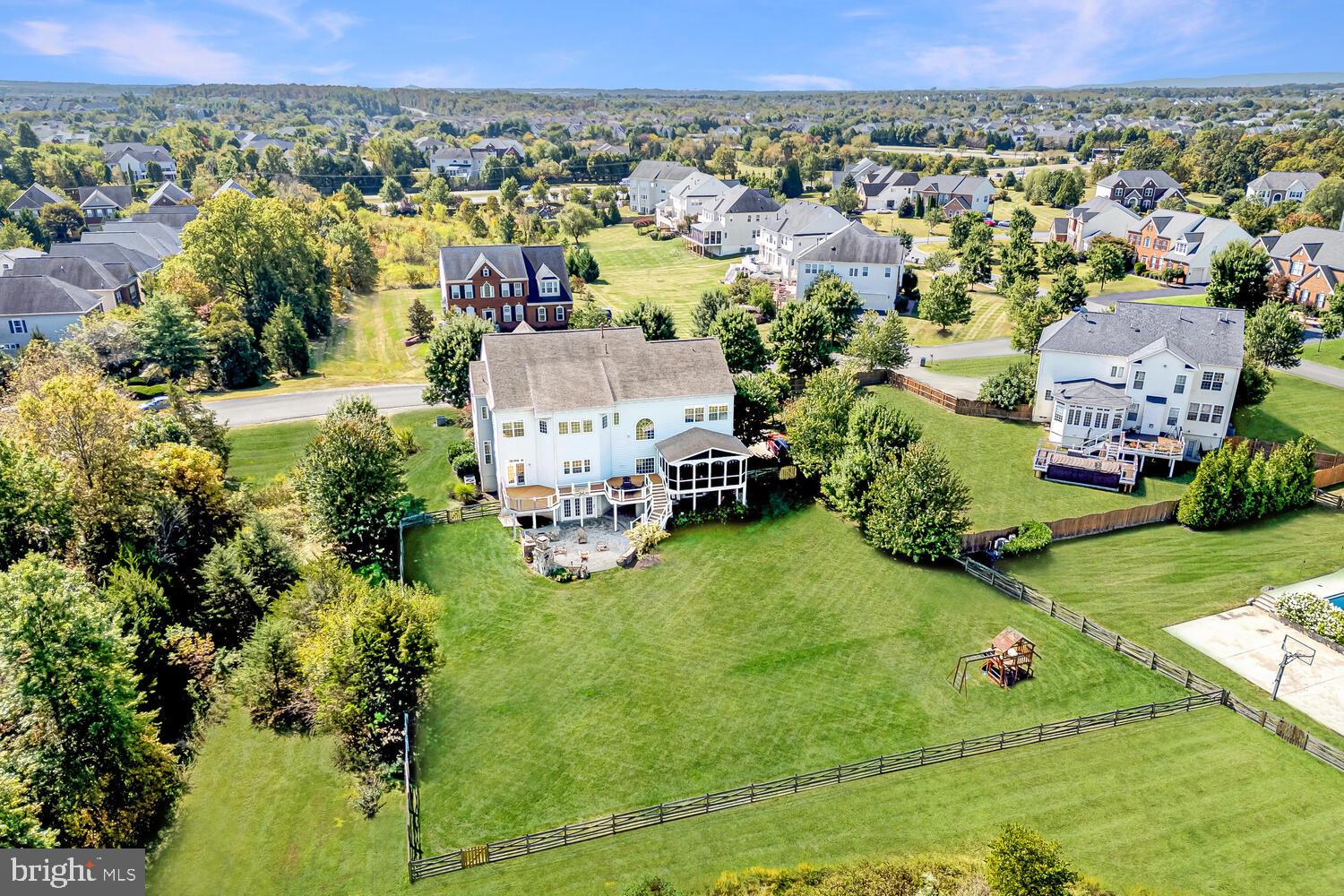 43024 La Riva Drive Ashburn, VA 20148 - Photo 59 of 63 an aerial view of residential houses with outdoor space and trees