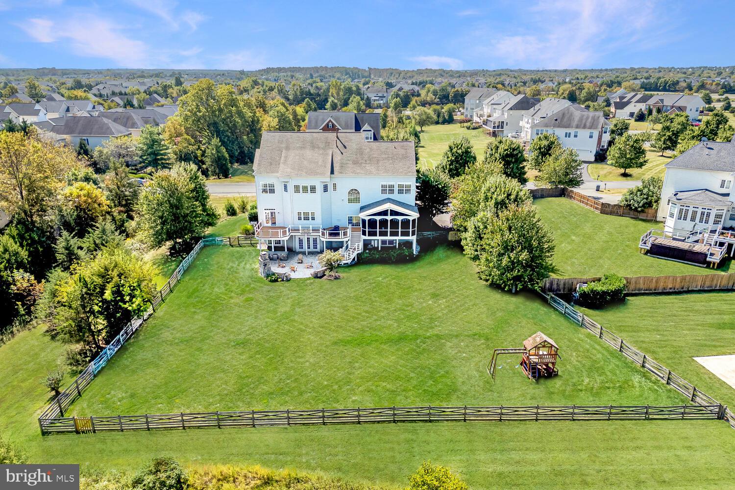43024 La Riva Drive Ashburn, VA 20148 - Photo 60 of 63 an aerial view of a house with a garden and lake view