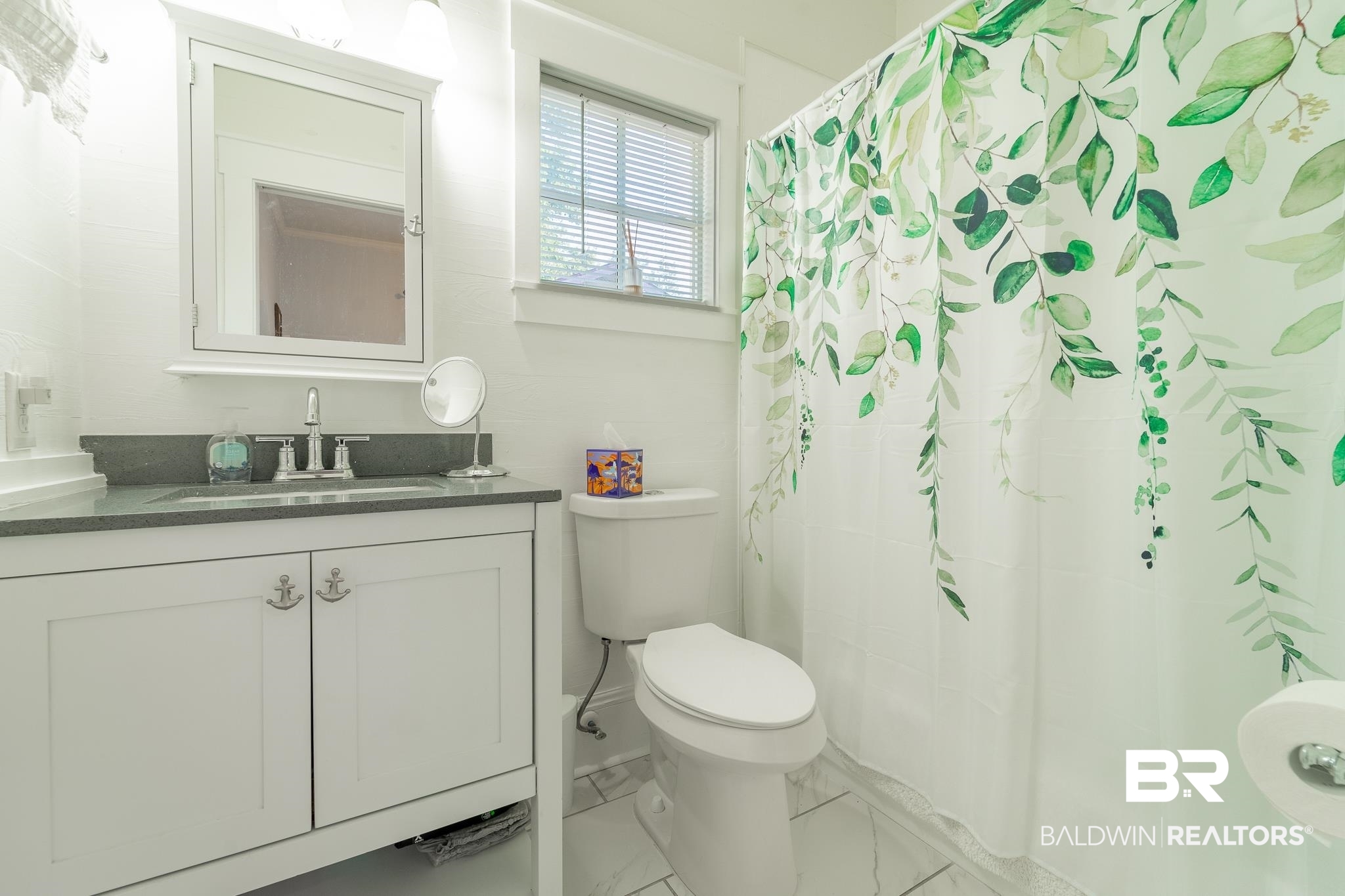 950 Texas Street Mobile, AL 36604 - Photo 10 of 17 Bathroom with tile patterned flooring, toilet, a shower with shower curtain, and vanity