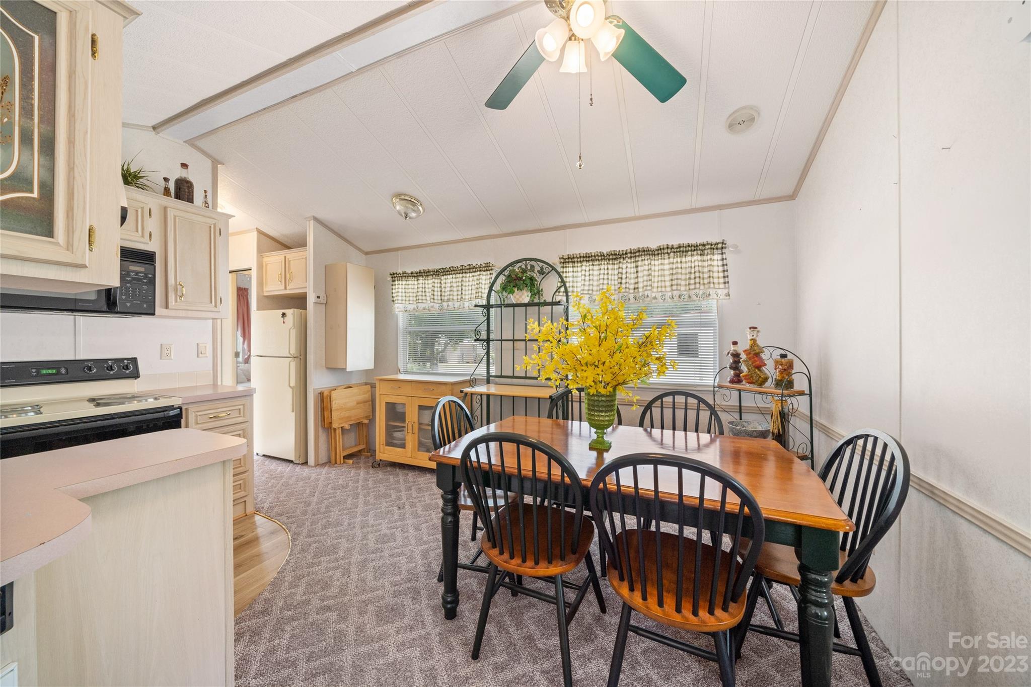 230 Pike Point Waynesville, NC 28785 - Photo 13 of 30 a view of a dining room with furniture window and wooden floor