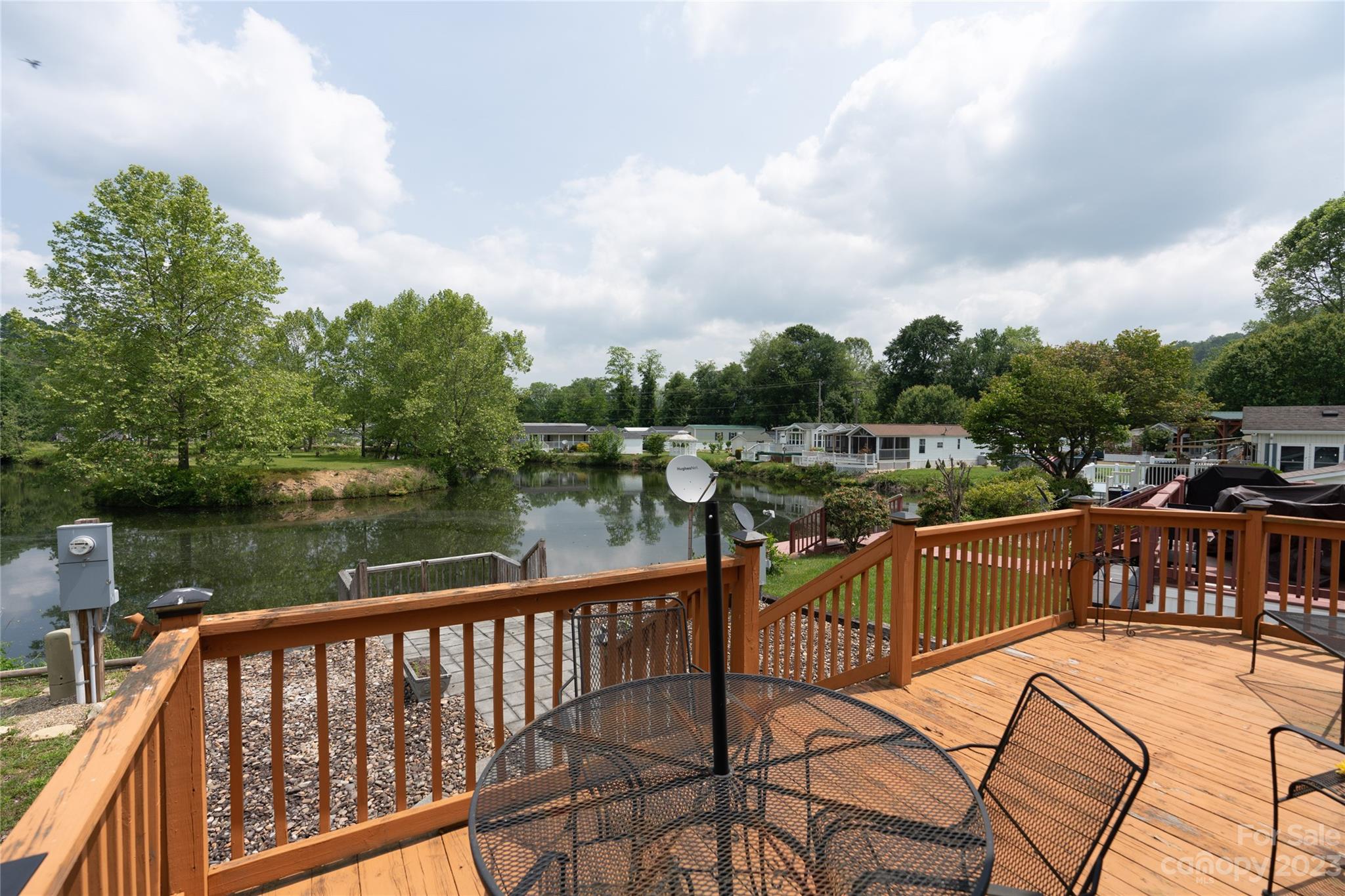 230 Pike Point Waynesville, NC 28785 - Photo 18 of 30 a view of a lake with a deck