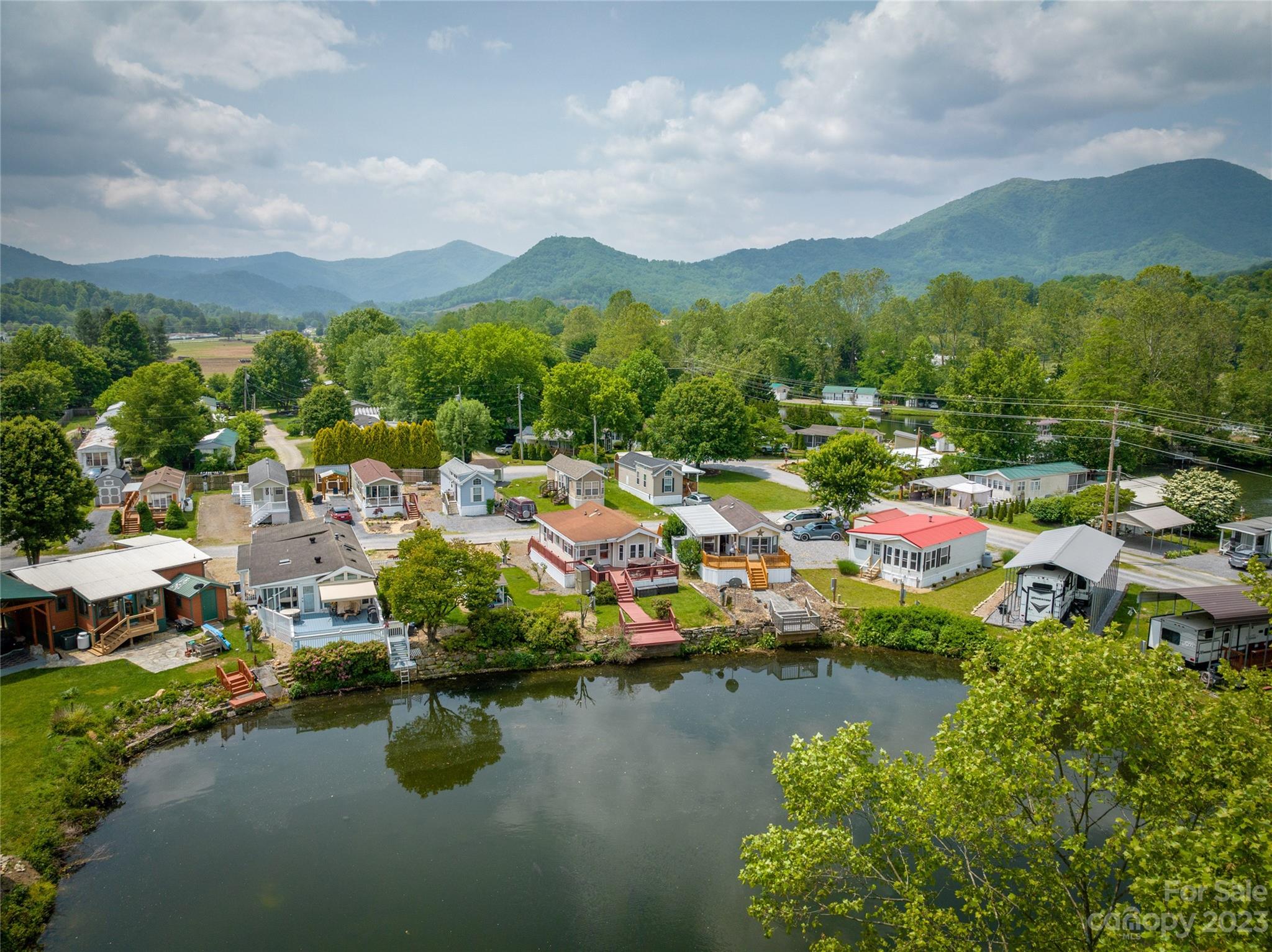 230 Pike Point Waynesville, NC 28785 - Photo 2 of 30 a view of a lake with a mountain