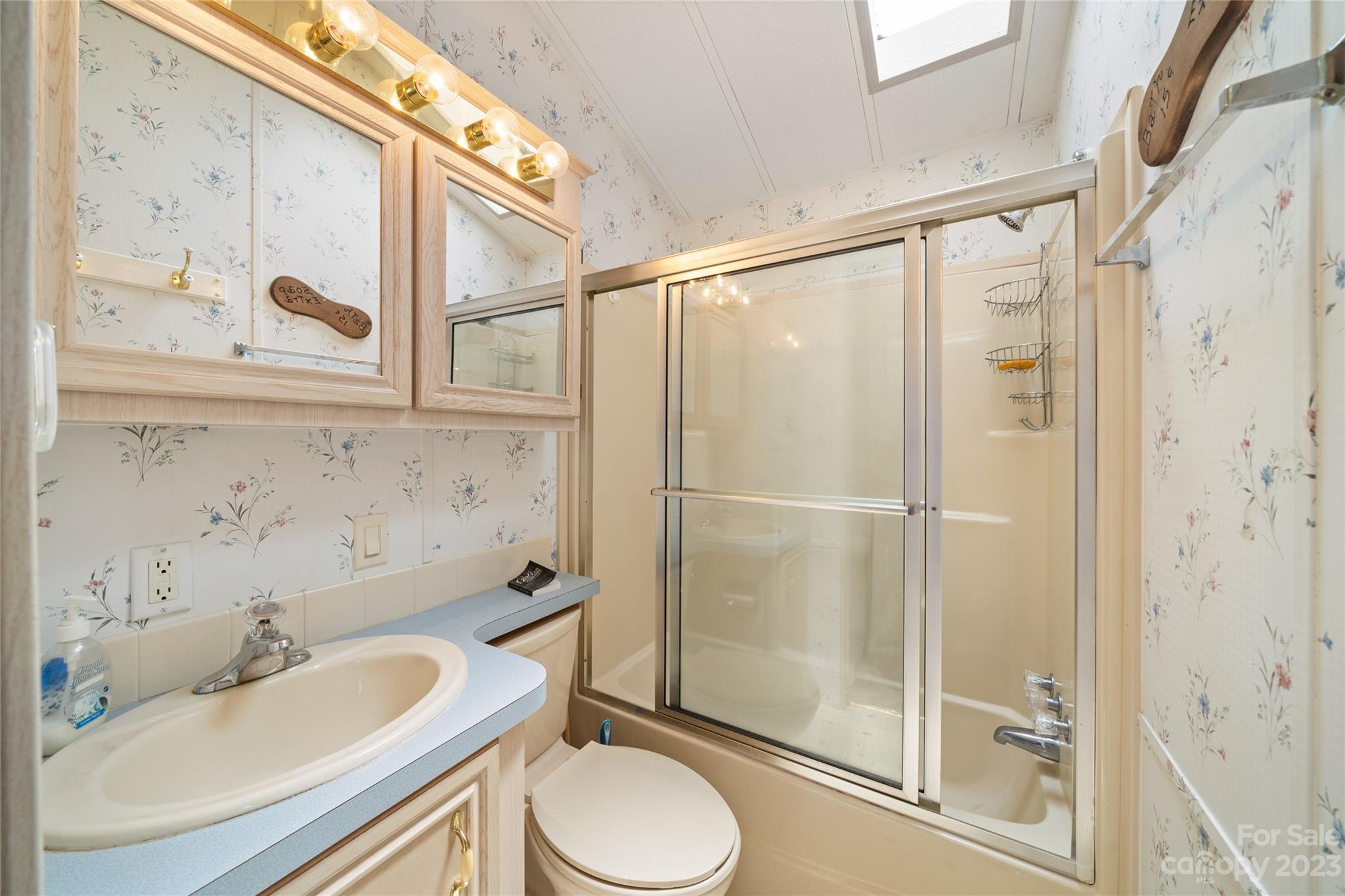 230 Pike Point Waynesville, NC 28785 - Photo 21 of 30 a bathroom with a sink toilet and shower