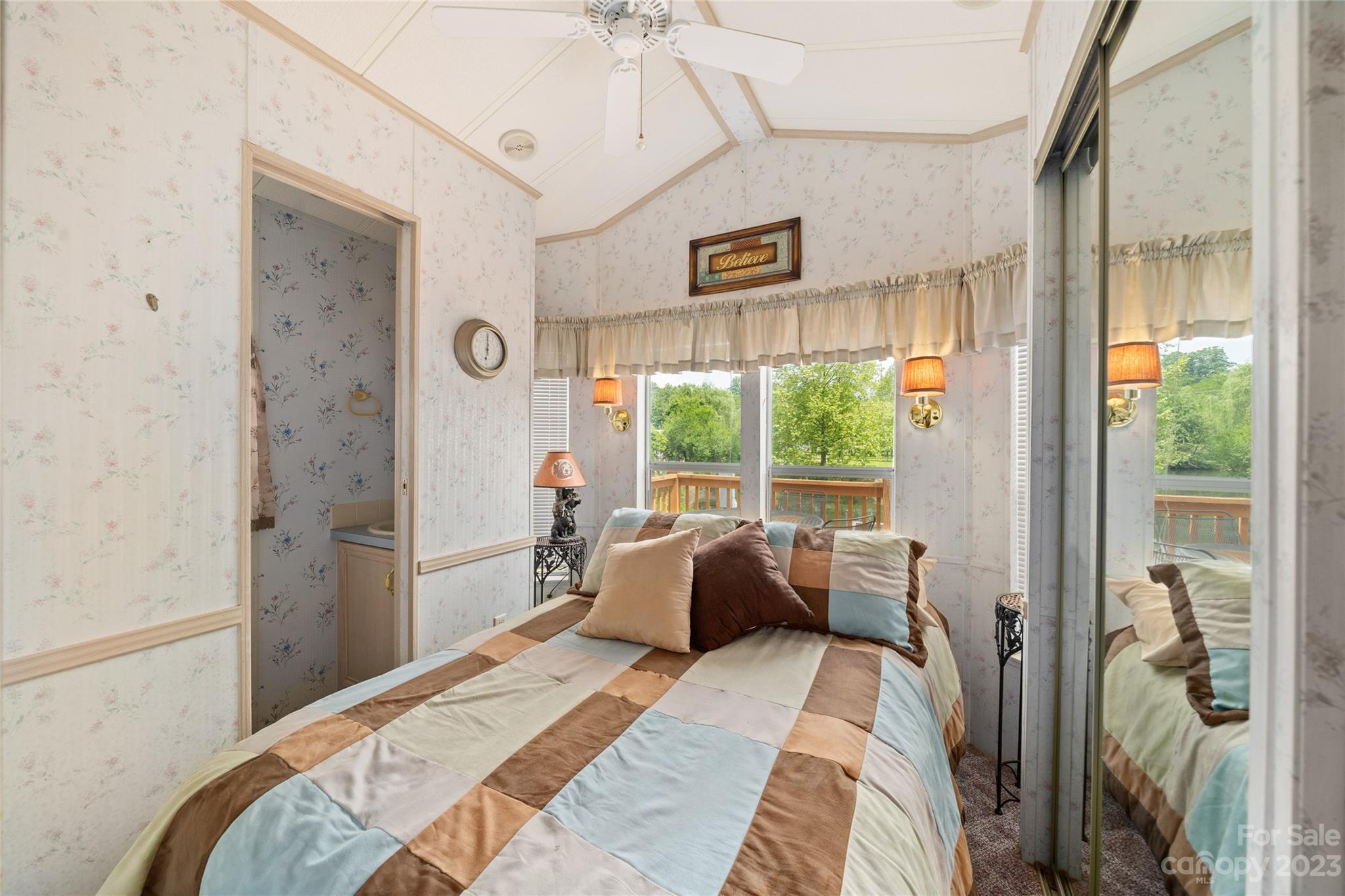 230 Pike Point Waynesville, NC 28785 - Photo 22 of 30 a bedroom with a bed and a large window