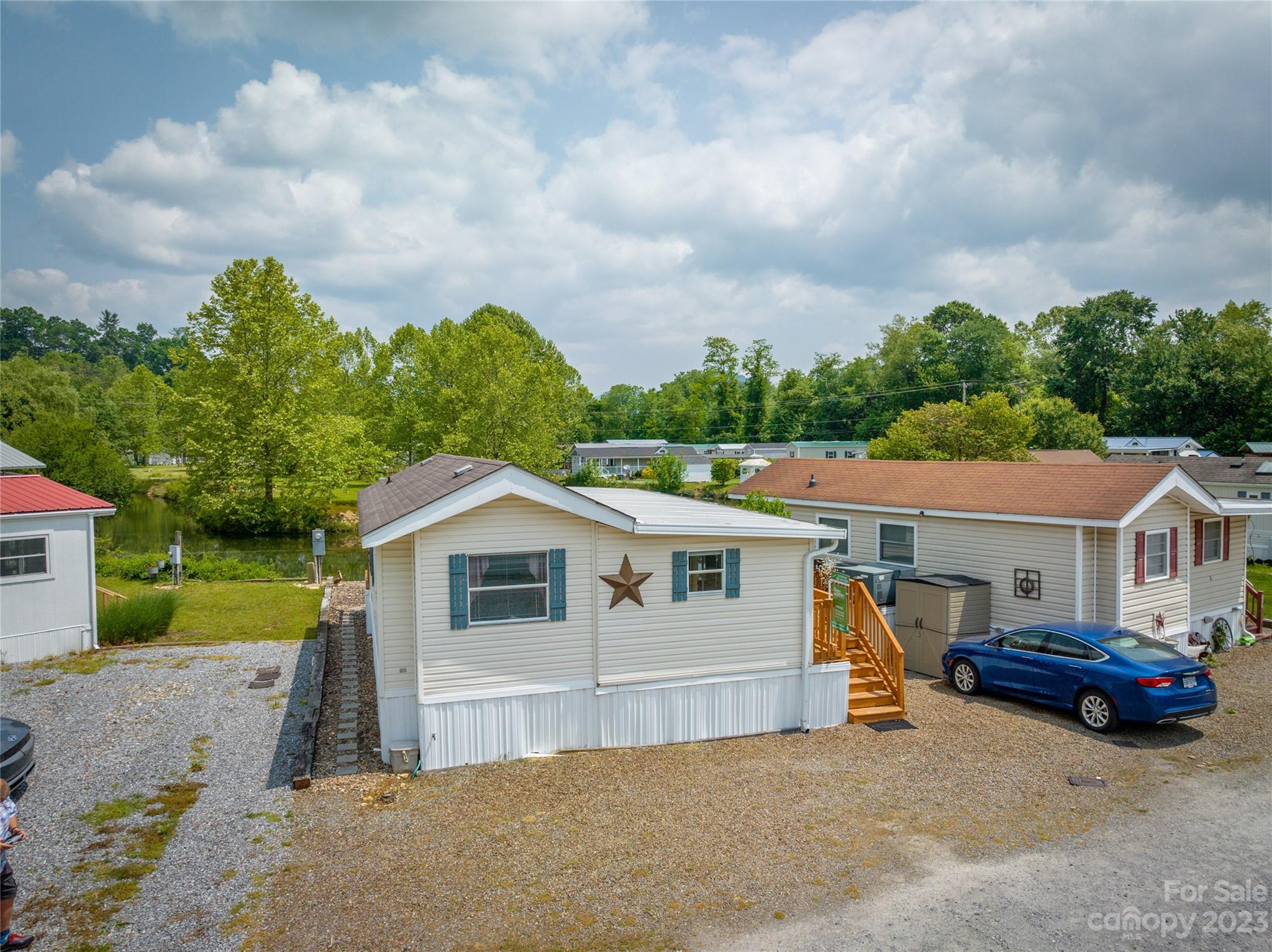 230 Pike Point Waynesville, NC 28785 - Photo 29 of 30 a view of a white house with a big yard and large trees