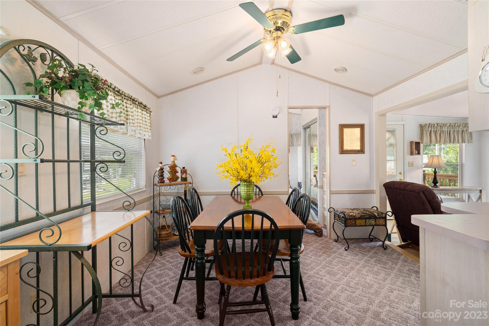 230 Pike Point Waynesville, NC 28785 - Photo 3 of 30 a view of a dining room with furniture window and wooden floor
