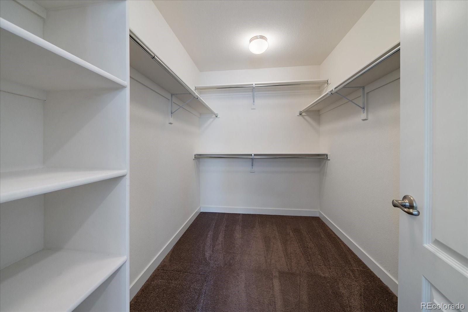 16062 Red Bud Loop Parker, CO 80134 - Photo 26 of 36 a view of a room with wooden floor