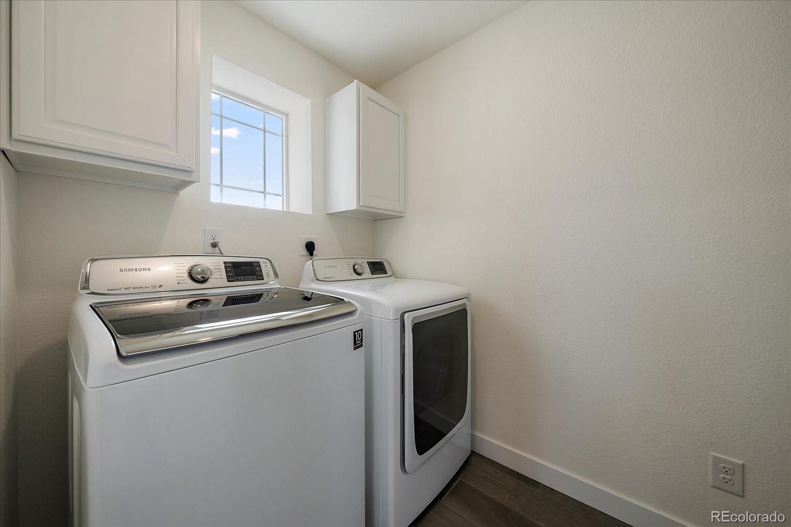 16062 Red Bud Loop Parker, CO 80134 - Photo 30 of 36 a utility room with dryer and washer
