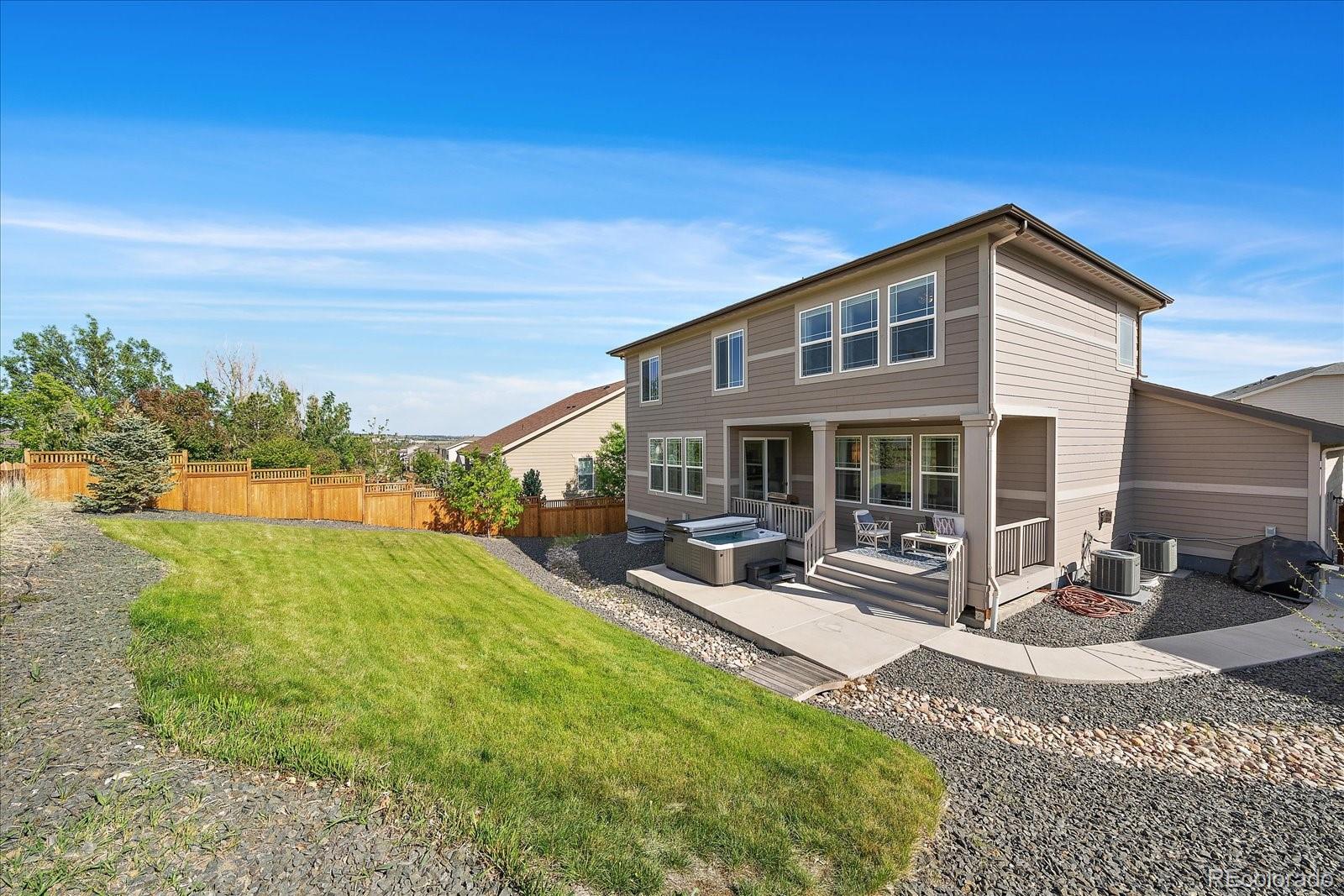16062 Red Bud Loop Parker, CO 80134 - Photo 33 of 36 a view of a house with sitting area and garden