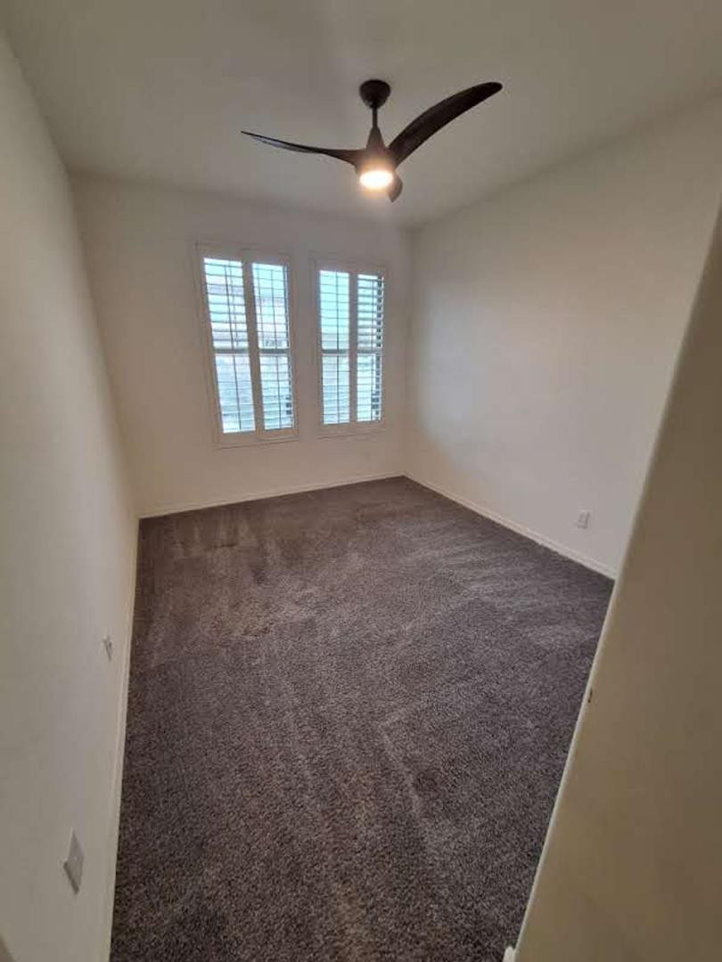 18541 West Mescal Street Surprise, AZ 85388 - Photo 23 of 31 an empty room with windows and fan