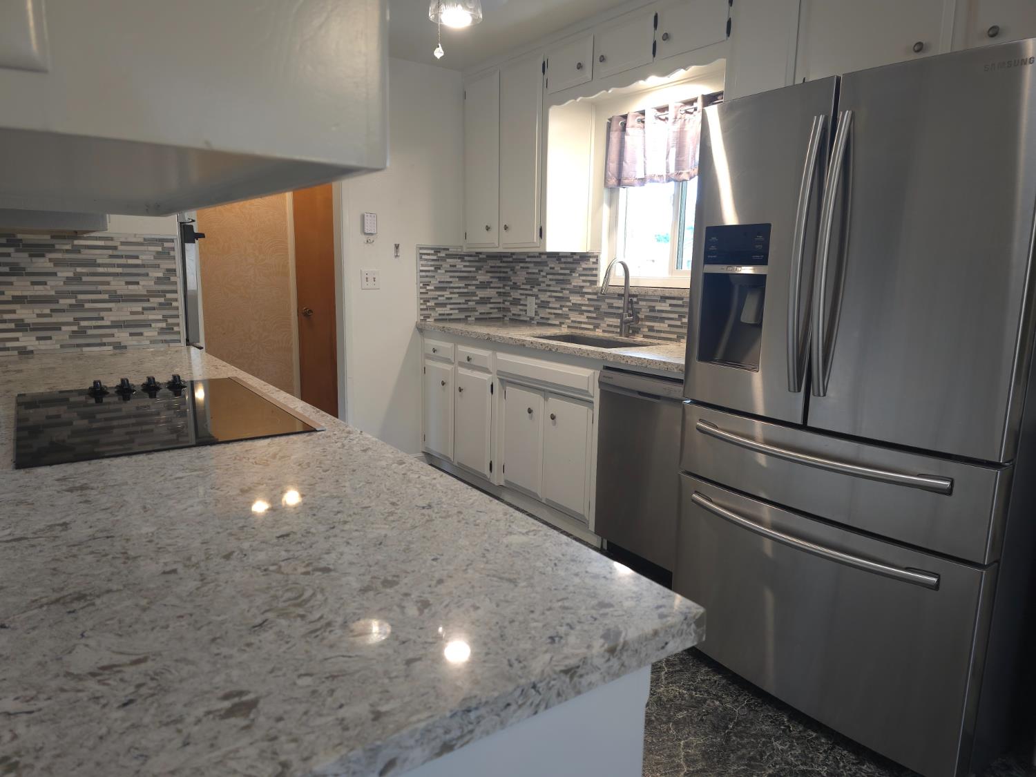 1601 Jacquelyn Way Modesto, CA 95355 - Photo 11 of 23 a kitchen with stainless steel appliances granite countertop a refrigerator a sink and a stove