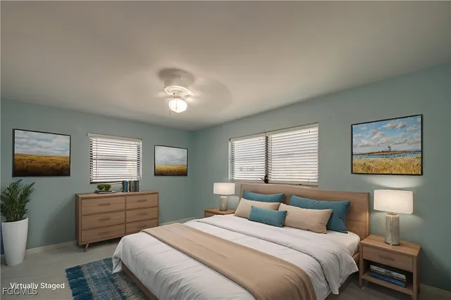 a view of a dining room with furniture large windows and wooden floor