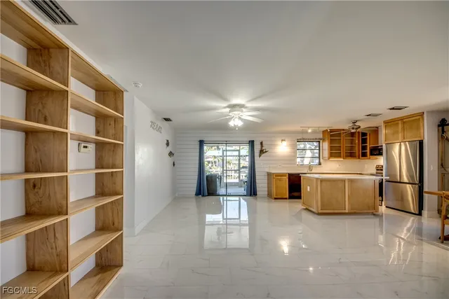 a kitchen with stainless steel appliances granite countertop a stove and a refrigerator