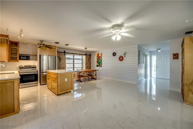 a kitchen with a refrigerator and countertop