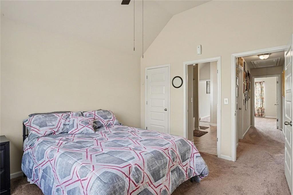 12155 Centerra Drive Hampton, GA 30228 - Photo 18 of 31 a bedroom with a bed and closet