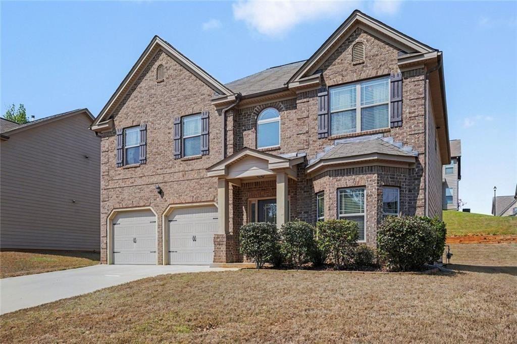 12155 Centerra Drive Hampton, GA 30228 - Photo 2 of 31 front view of a house with a yard