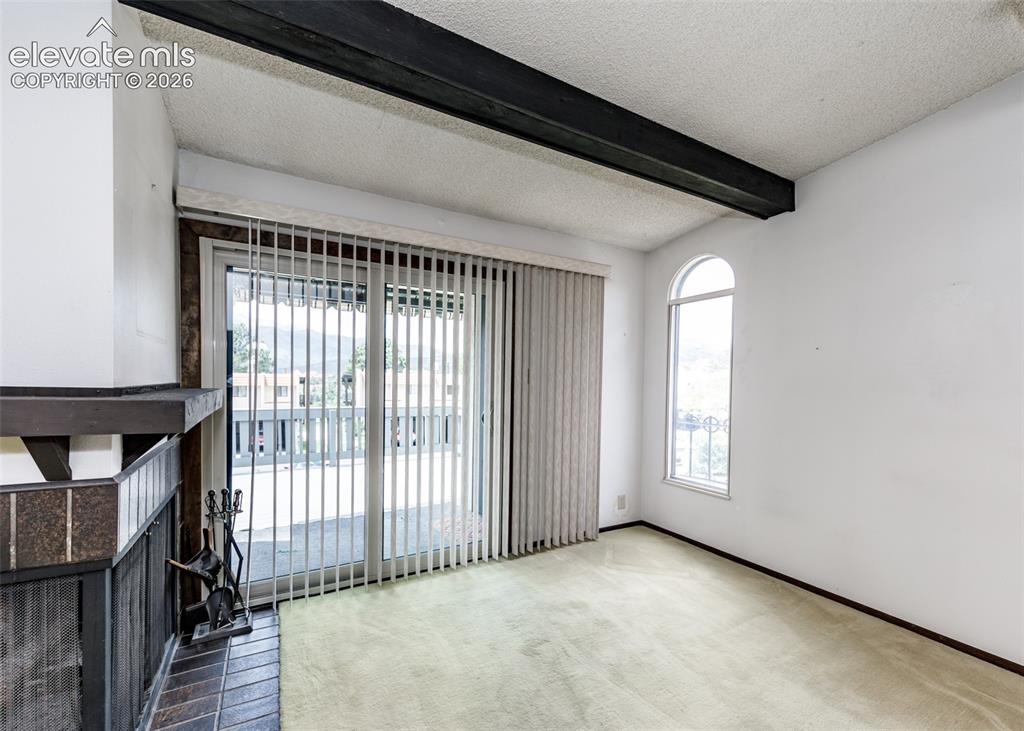 1034 Fontmore Road, Unit D Colorado Springs, CO 80904 - Photo 14 of 43 a view of an empty room and a window