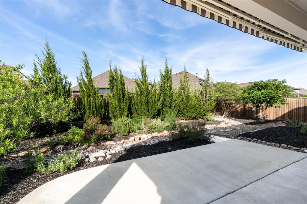1314 Buttermere Street Forney, TX 75126 - Photo 8 of 32 a view of a garden with a pathway