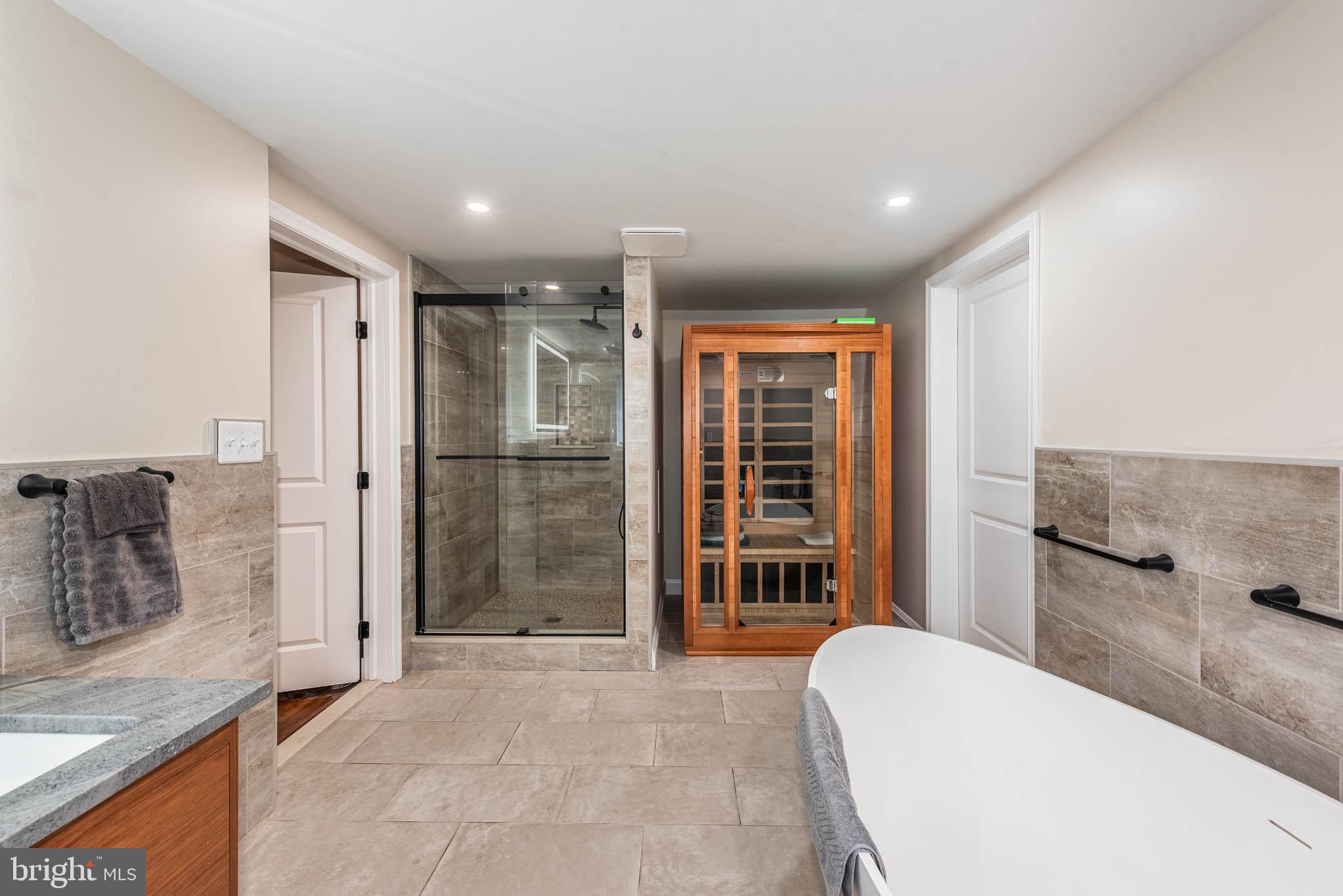 2705 Spring Hill Road Pikesville, MD 21208 - Photo 18 of 43 a bathroom with a tub and shower
