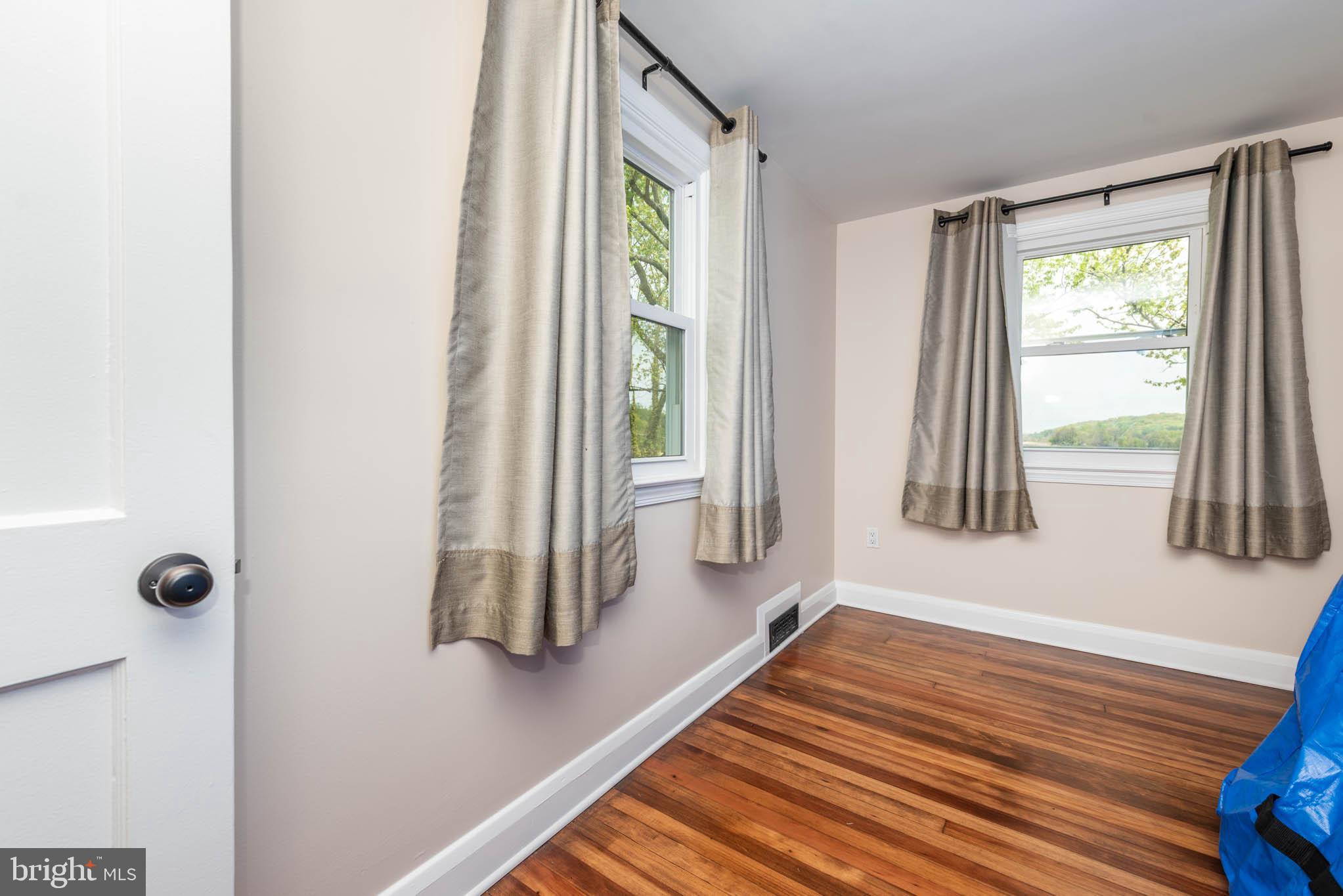 2705 Spring Hill Road Pikesville, MD 21208 - Photo 21 of 43 a view of an entryway with wooden floor and windows