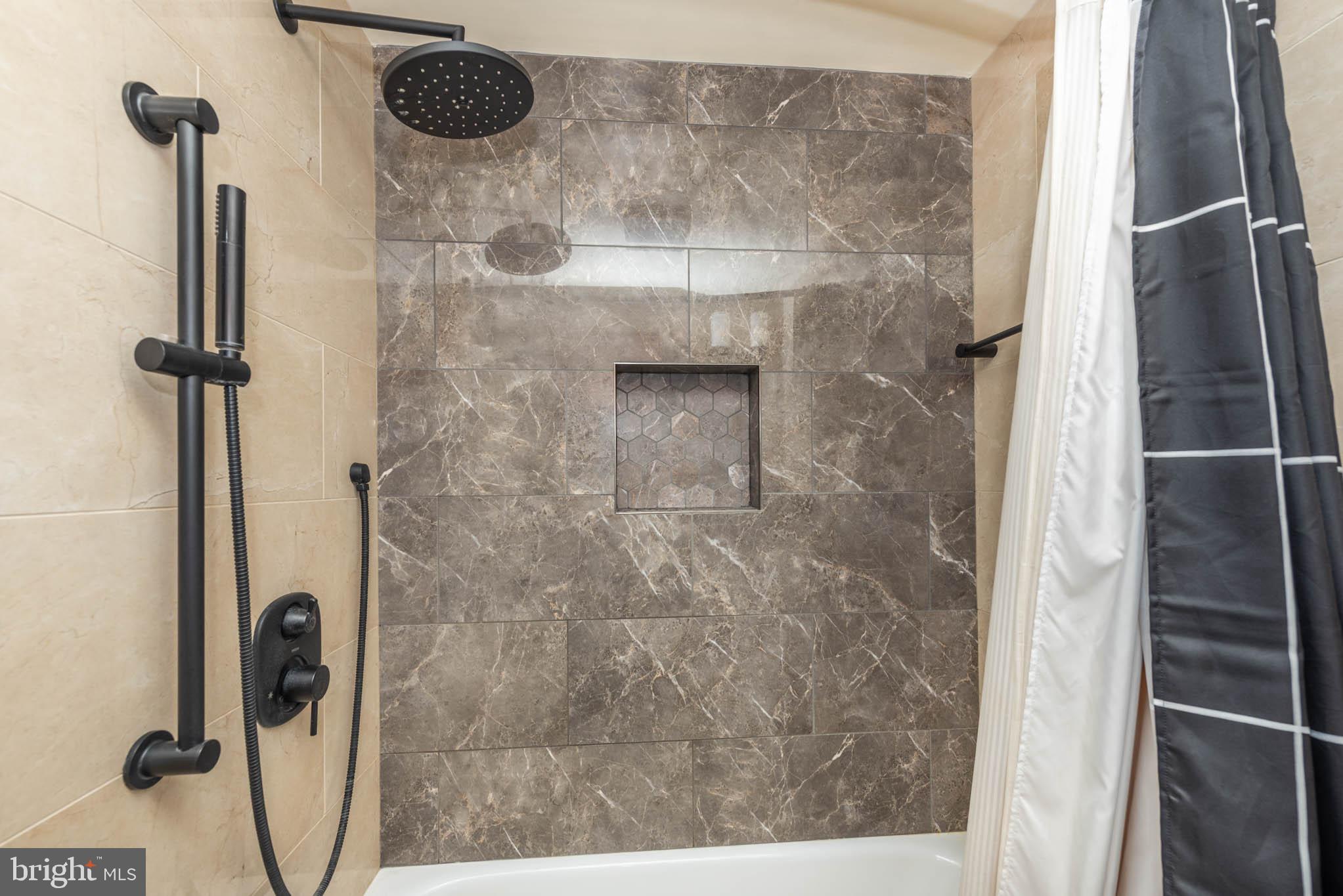 2705 Spring Hill Road Pikesville, MD 21208 - Photo 25 of 43 a bathroom with a shower