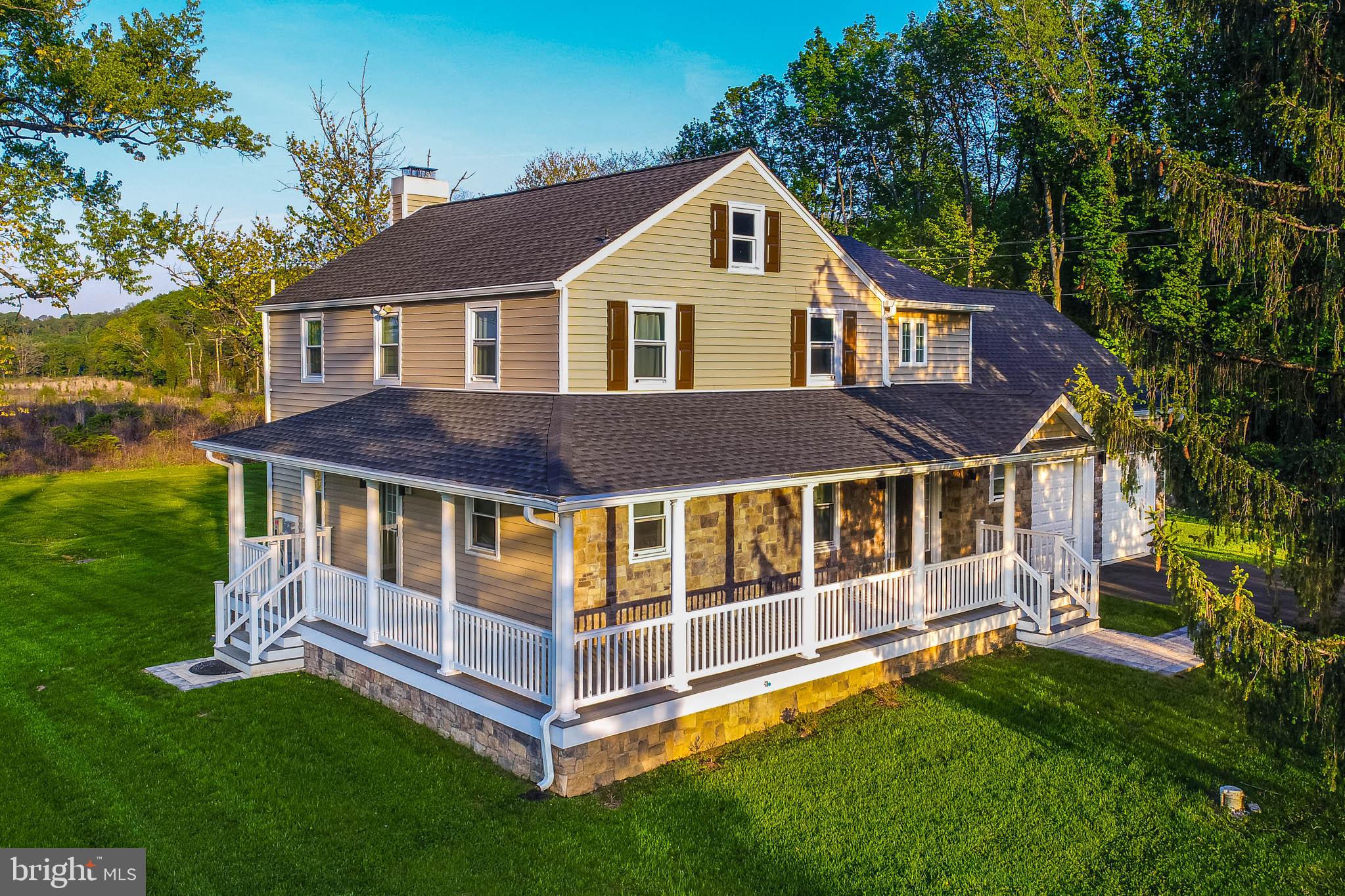 2705 Spring Hill Road Pikesville, MD 21208 - Photo 40 of 43 a front view of a house with a yard balcony and wooden fence