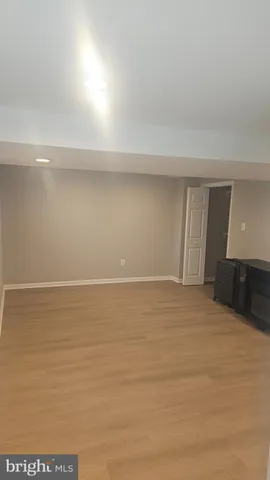 a white toilet sitting next to a shower