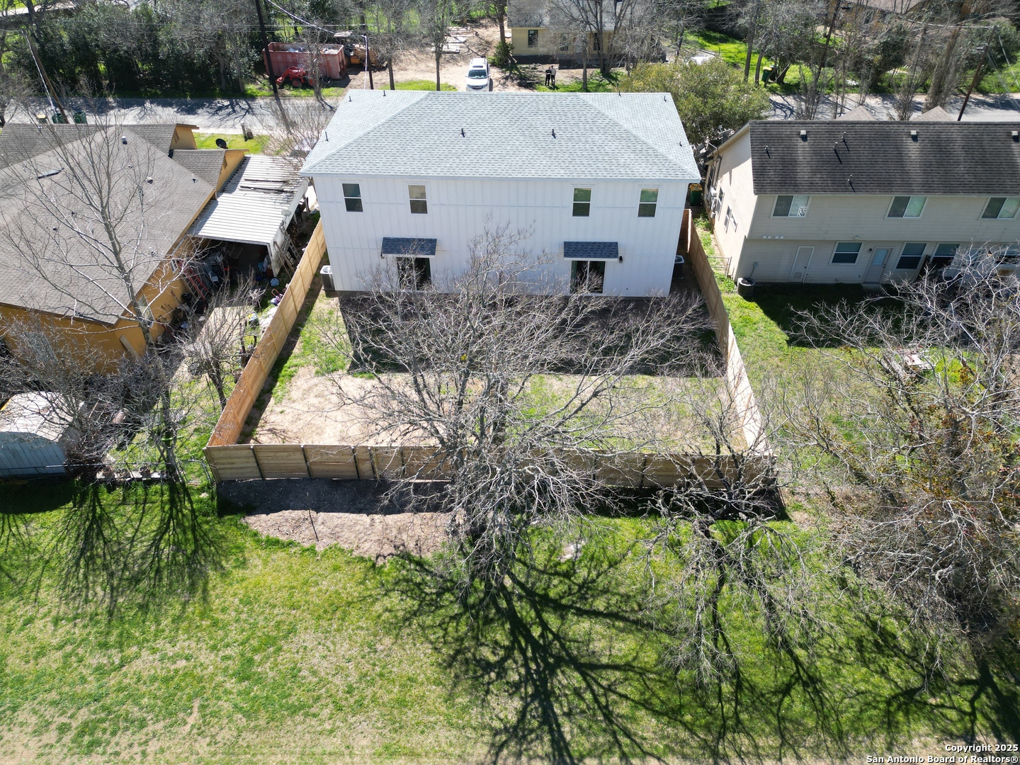 327 Ebner Street, Unit B Boerne, TX 78006 - Photo 17 of 21 an aerial view of a house with a yard and potted plants