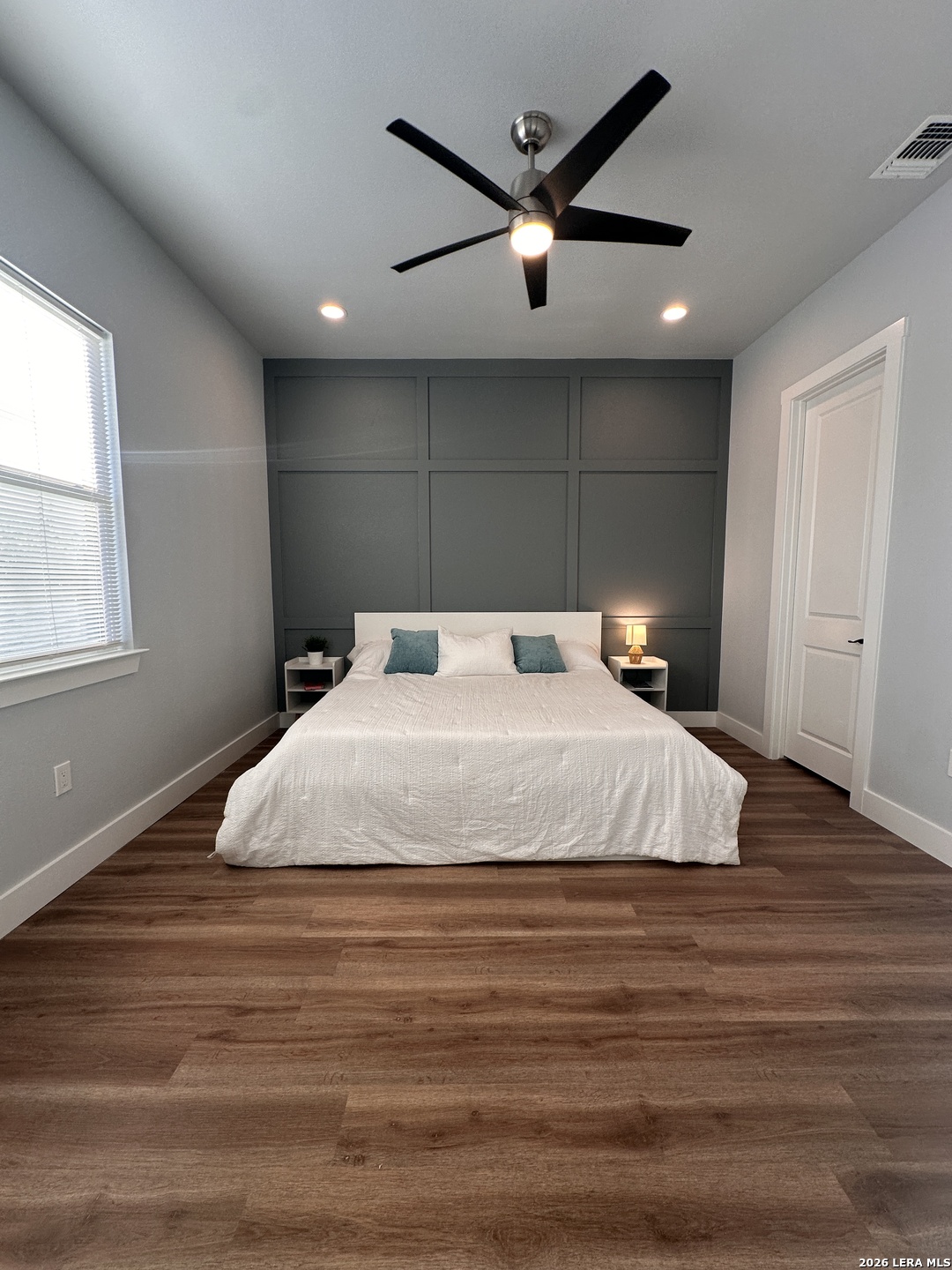 327 Ebner Street, Unit B Boerne, TX 78006 - Photo 4 of 21 a bedroom with a large bed and a large window