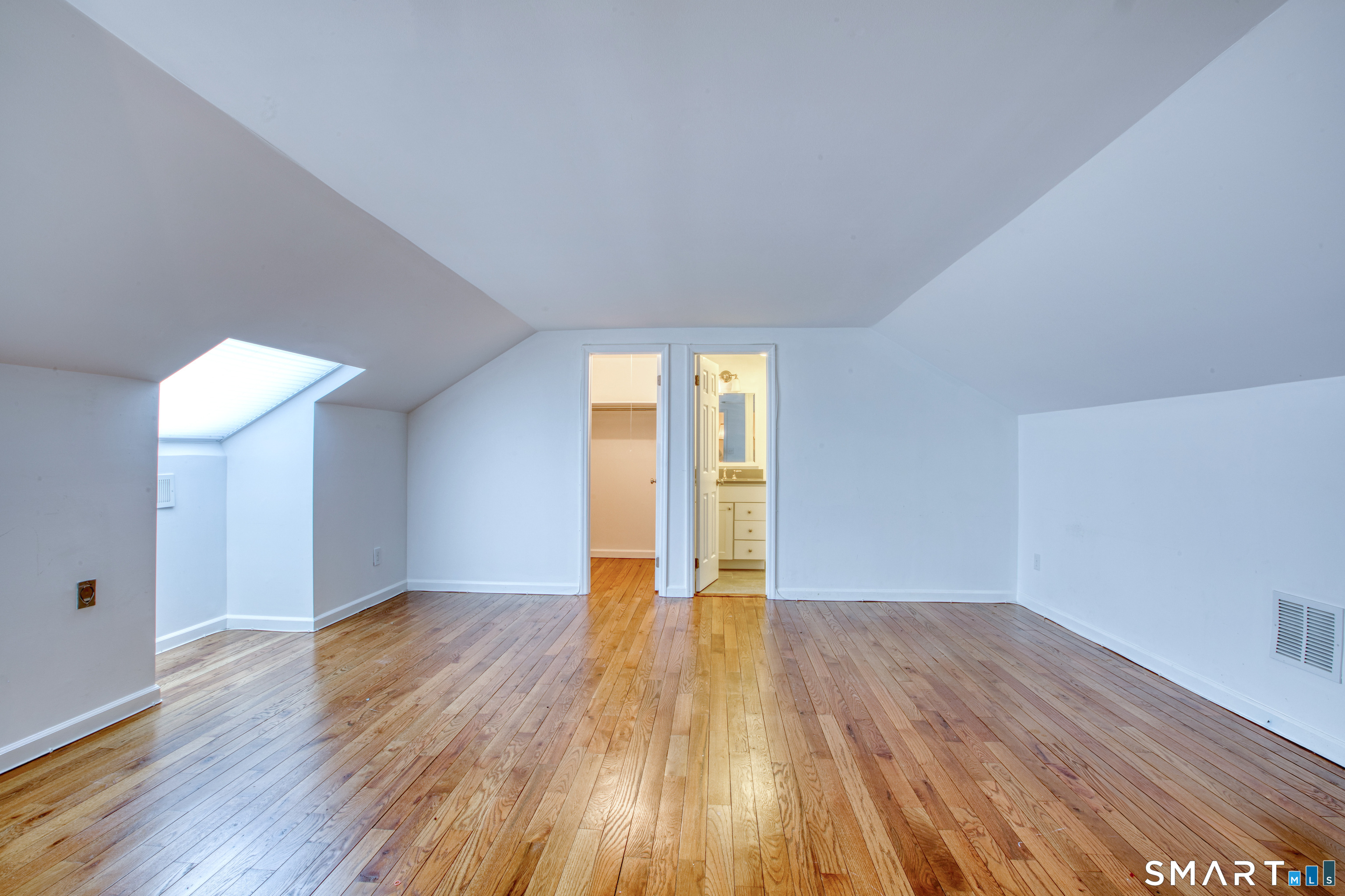 9 Georgetowne North Greenwich, CT 06831 - Photo 15 of 35 an empty room with wooden floor and windows