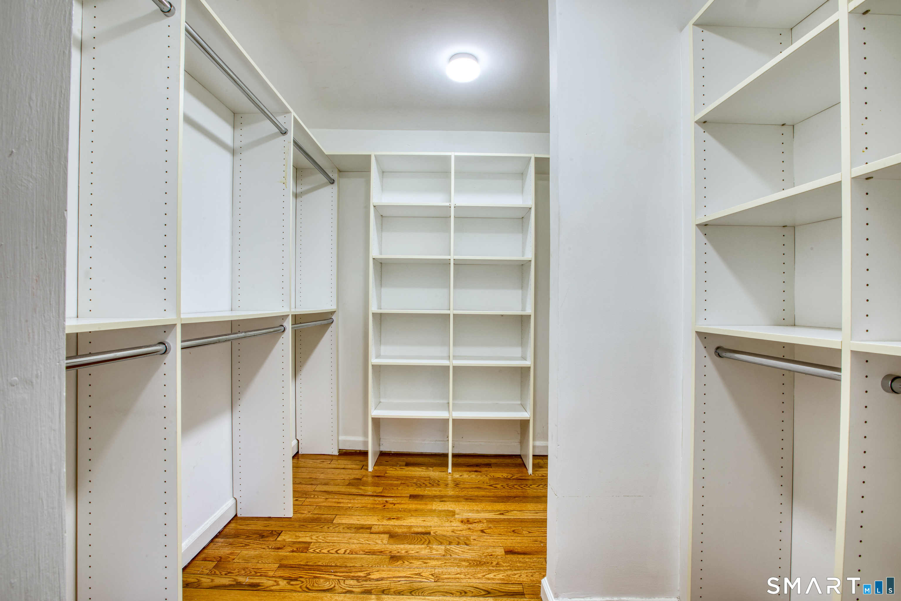 9 Georgetowne North Greenwich, CT 06831 - Photo 22 of 35 a room with walk in closet and empty racks