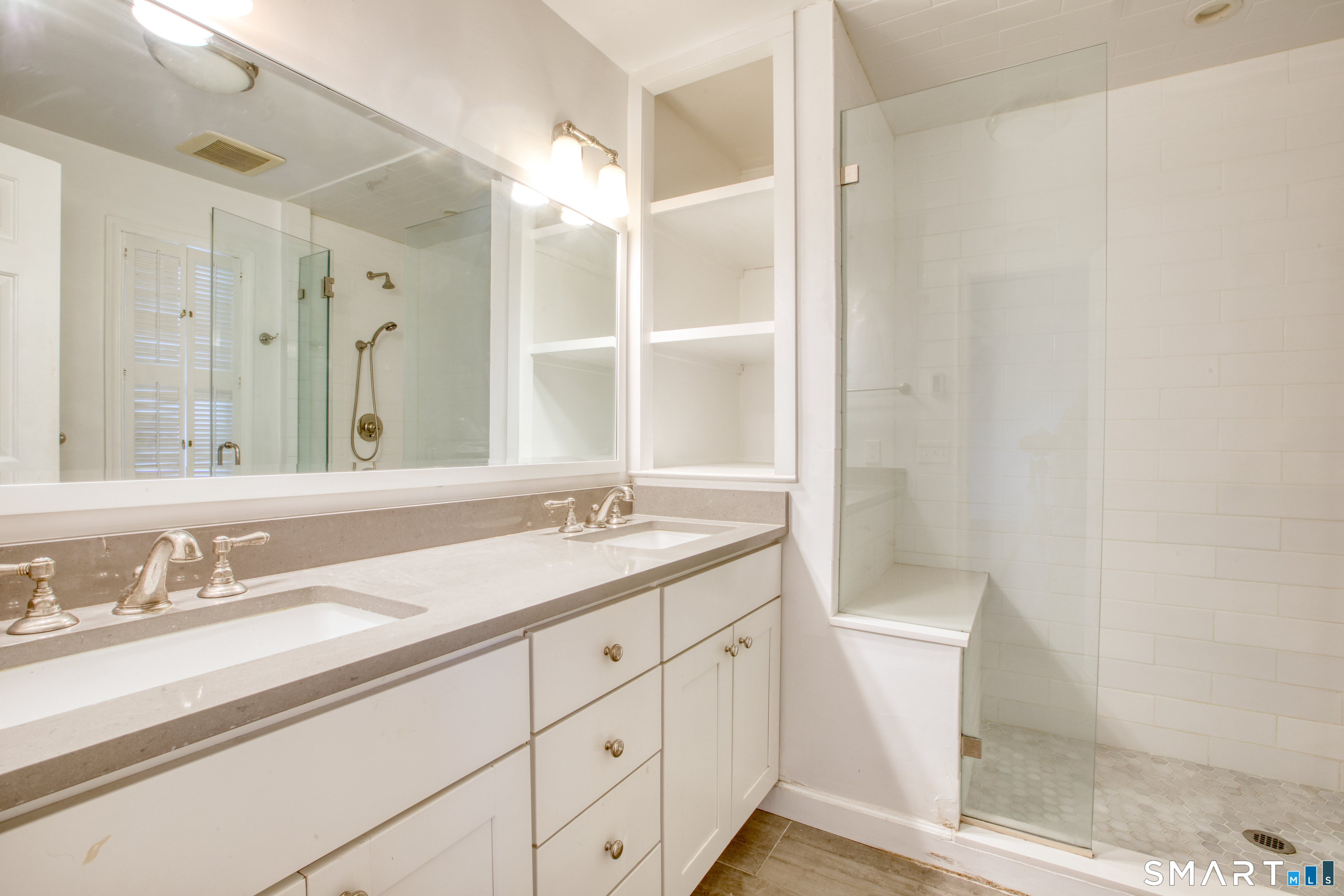9 Georgetowne North Greenwich, CT 06831 - Photo 24 of 35 a bathroom with a granite countertop sink and a mirror