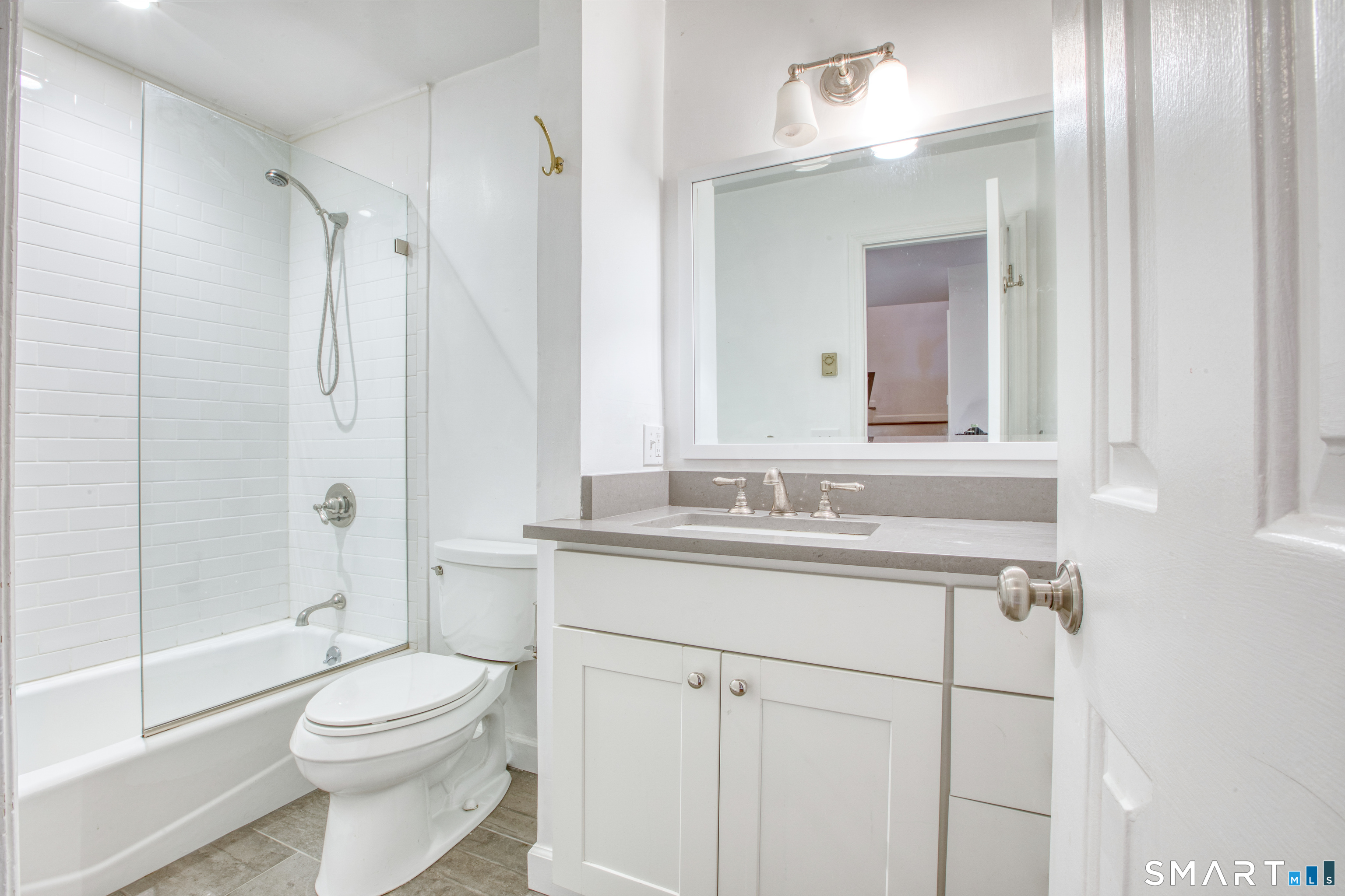 9 Georgetowne North Greenwich, CT 06831 - Photo 29 of 35 a bathroom with a sink a toilet and shower