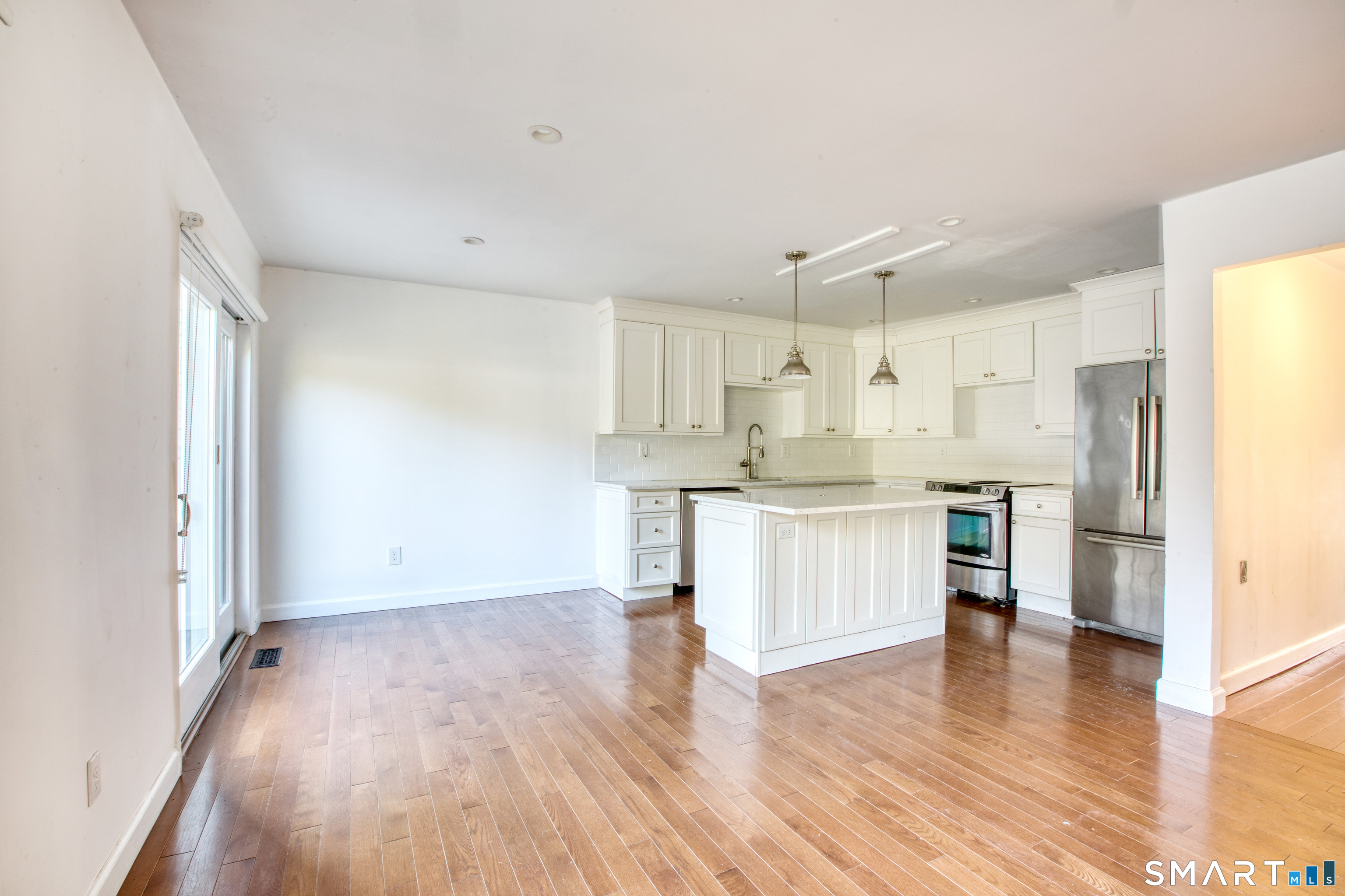 9 Georgetowne North Greenwich, CT 06831 - Photo 9 of 35 a kitchen with a refrigerator and a stove top oven