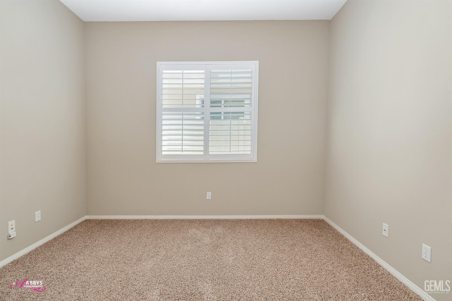Undisclosed Address Bakersfield, CA 93306 - Photo 14 of 49 an empty room with a window