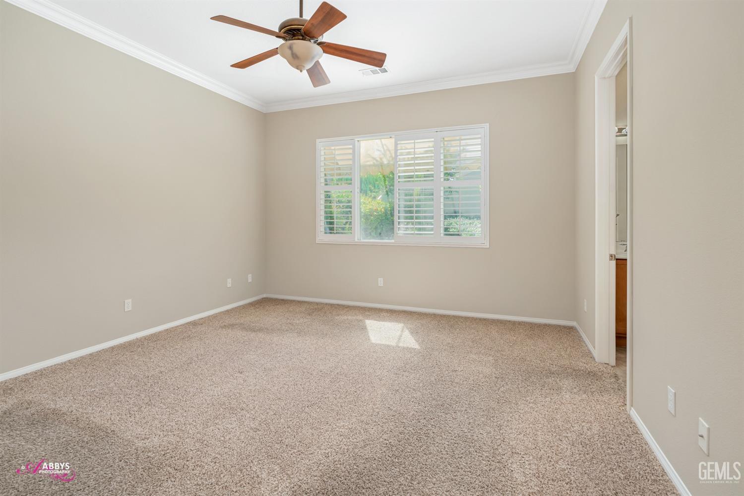 Undisclosed Address Bakersfield, CA 93306 - Photo 15 of 49 an empty room with a window and a fan