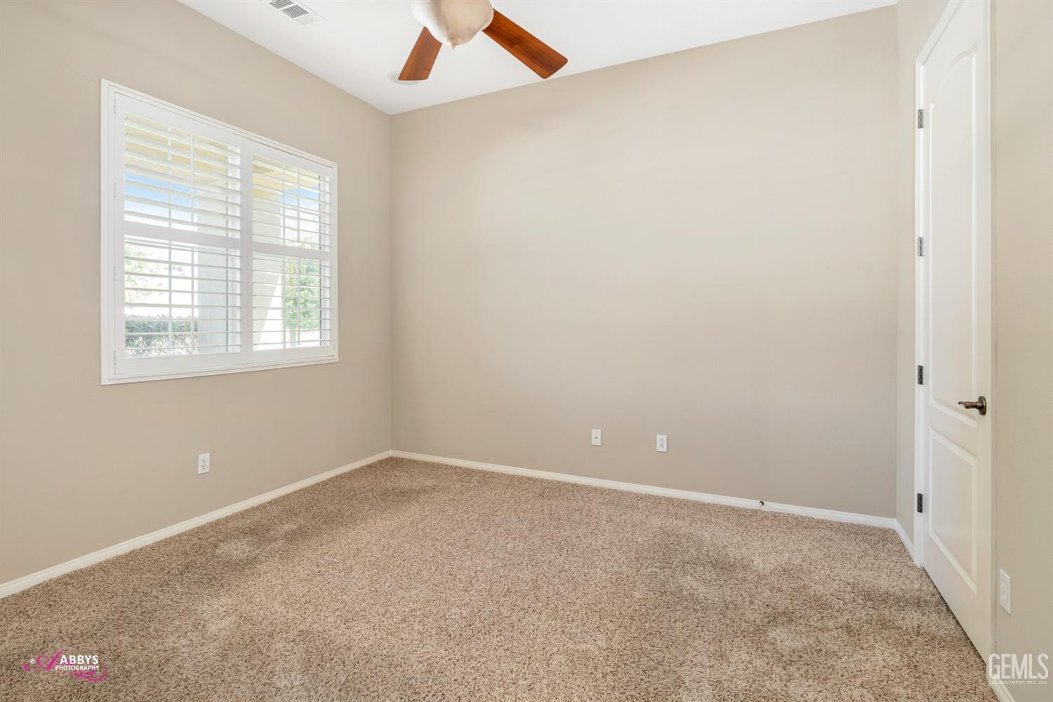 Undisclosed Address Bakersfield, CA 93306 - Photo 19 of 49 an empty room with a window