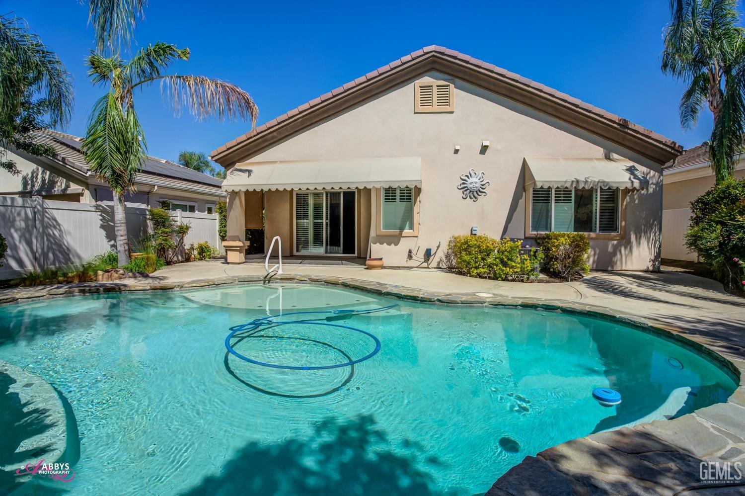 Undisclosed Address Bakersfield, CA 93306 - Photo 30 of 49 a view of a house with pool yard and a patio