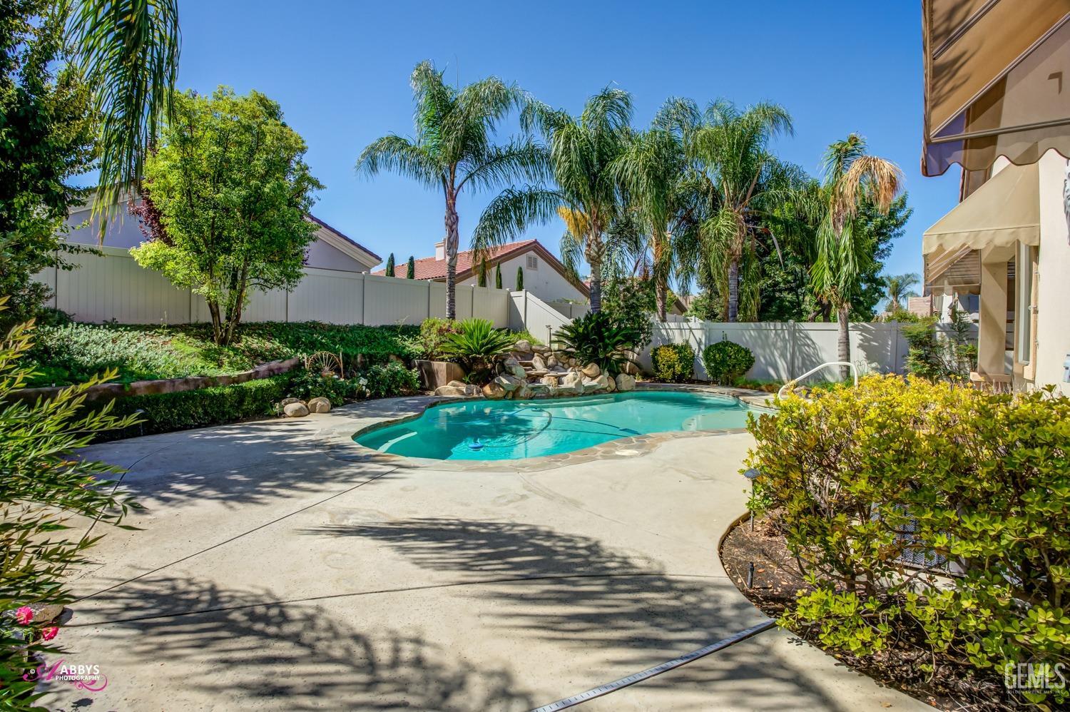 Undisclosed Address Bakersfield, CA 93306 - Photo 31 of 49 a front view of a house with a yard and fountain