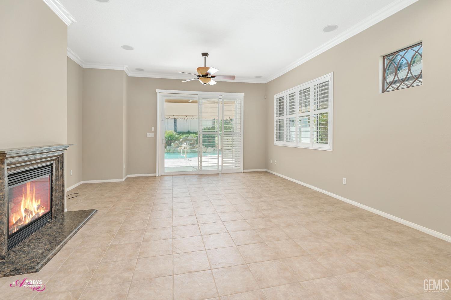 Undisclosed Address Bakersfield, CA 93306 - Photo 8 of 49 a view of an empty room with a fireplace